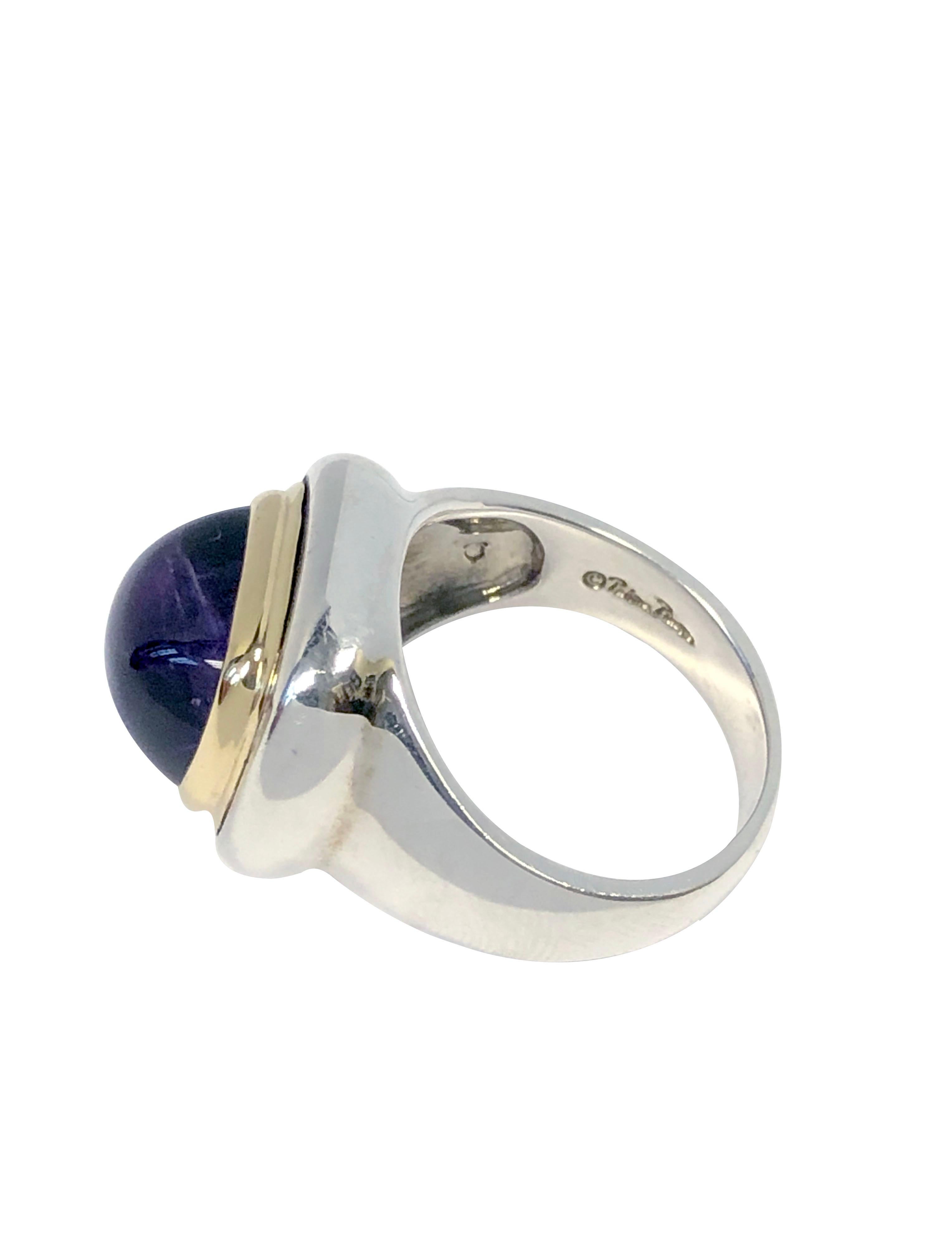 Circa 1980s Paloma Picasso for Tiffany & Company Sterling Silver and 18k Yellow Gold Ring, Set with a Fine color domed cabochon Amethyst, the top of the ring measures 5/8 x 1/2 inch. Finger size 7.  Excellent near unworn condition.