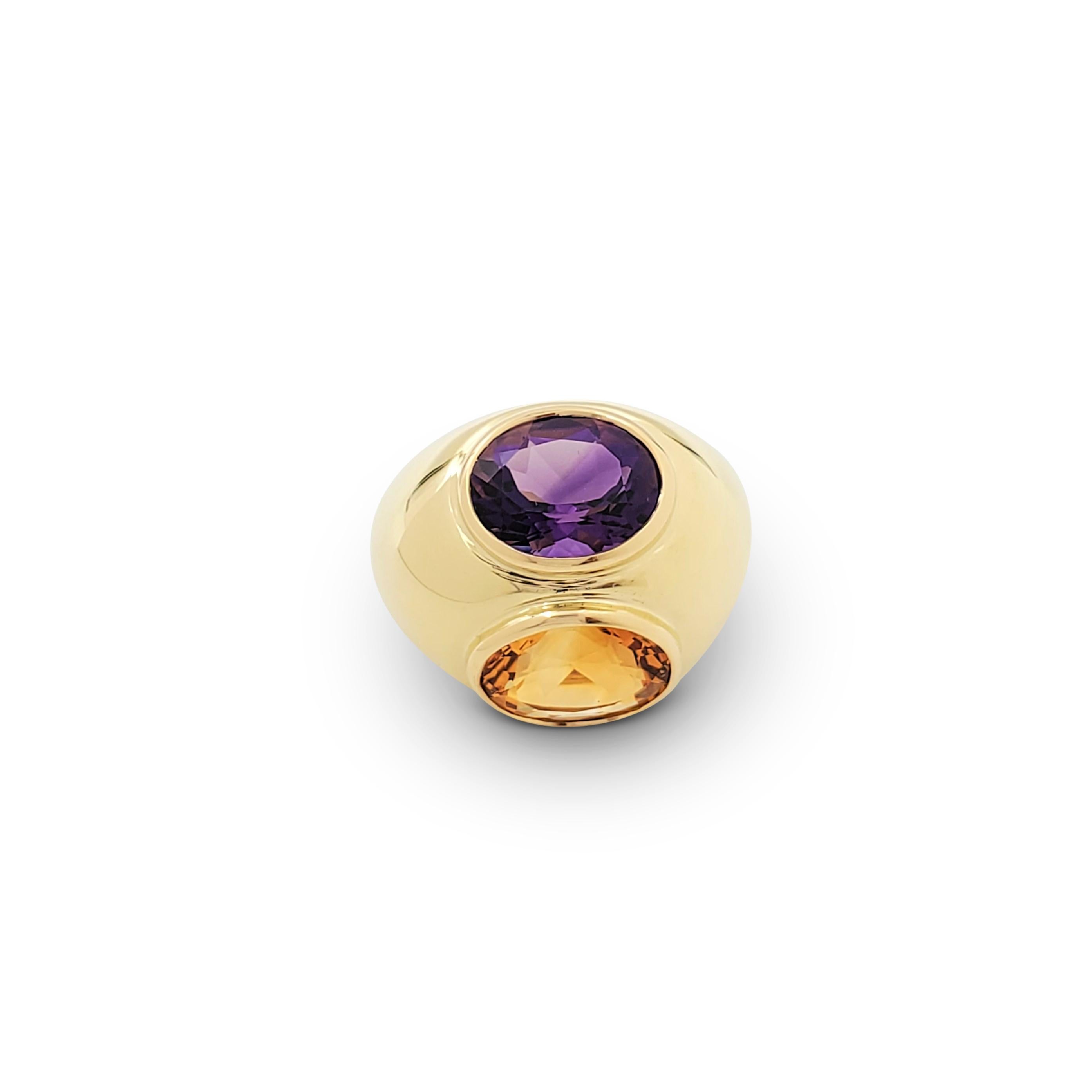 Authentic Paloma Picasso for Tiffany & Co. bombé ring with stylized Toi et Moi motif featuring an oval-shaped amethyst and citrine stone set in 18 karat yellow gold. Signed Paloma Picasso, Tiffany & Co., 750. The ring is presented with the original