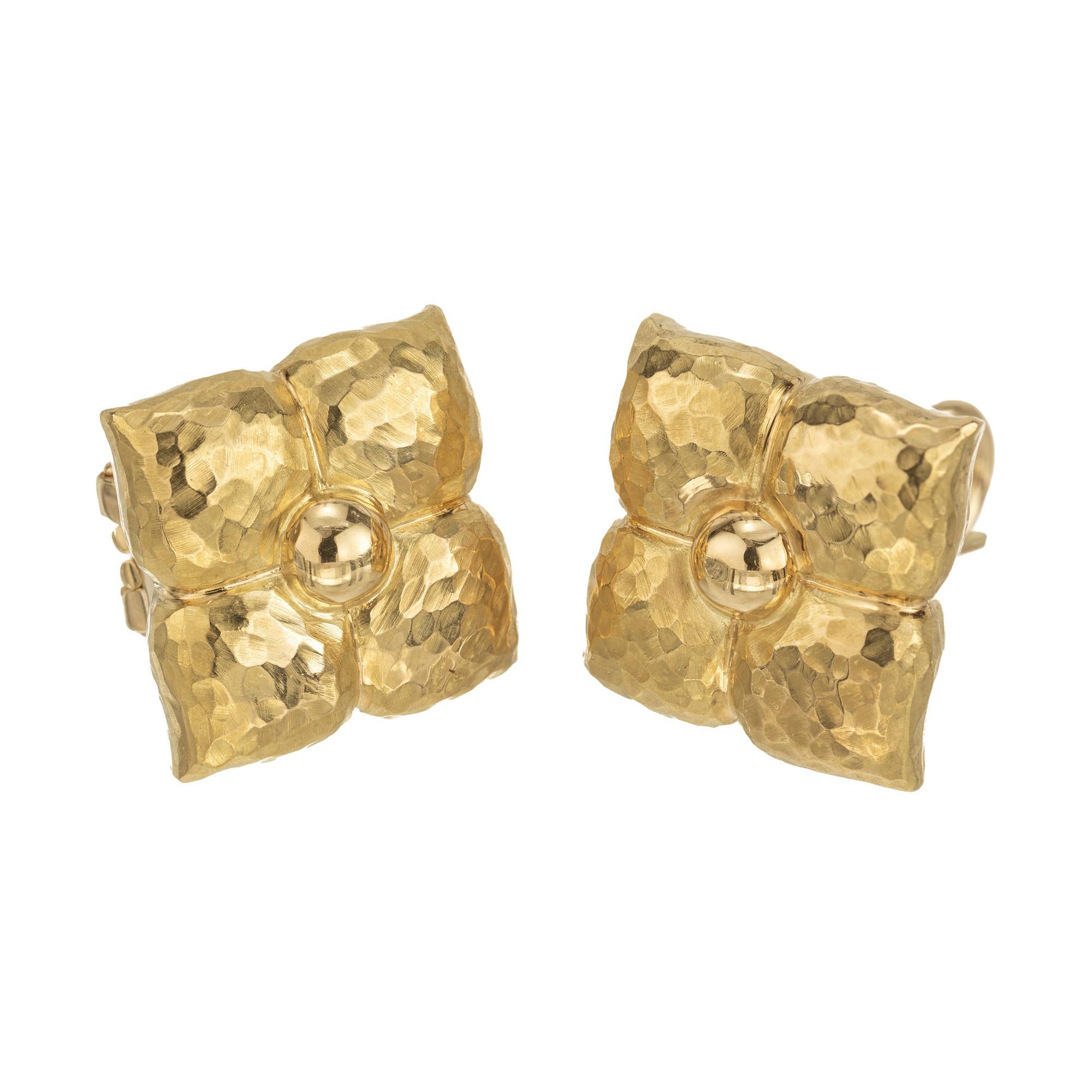 Paloma Picasso clip and post style 1970's earrings in a flower design. Made in Italy by Tiffany & Co. with 18k yellow gold. This exquisite piece is a stunning tribute to nature and artistry. Expertly crafted in Italy, these earrings feature a