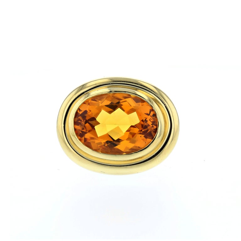 18K yellow gold ring for Tiffany & Co. by Paloma Picasso, featuring a faceted citrine in the center with a ridge bezel.  Ring is currently a size 5 1/2, and presentation area measures 7/8 of an inch by 3/4 of an inch. 