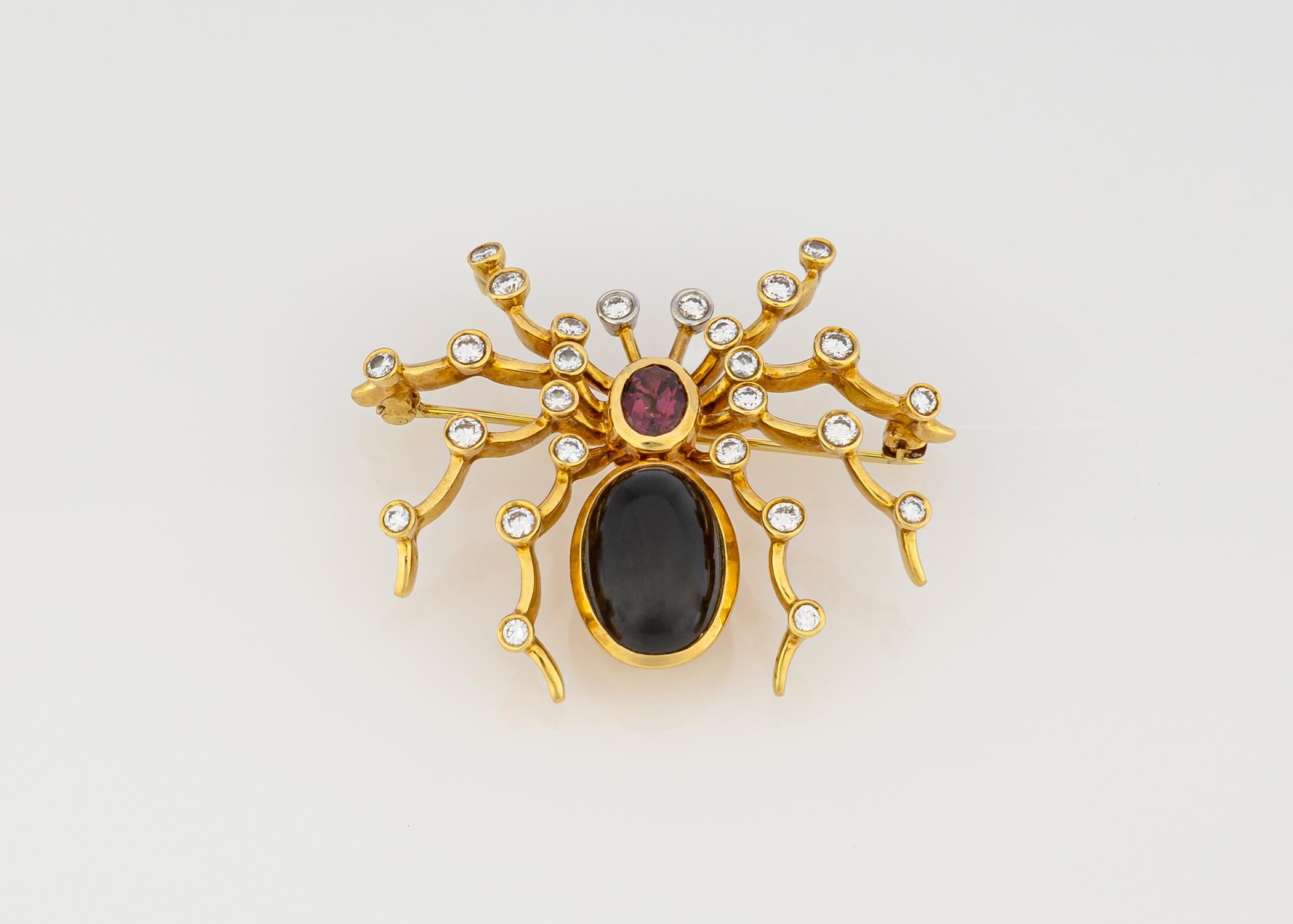 A rare Paloma Picasso design for Tiffany & Co. Black onyx, garnet and diamonds decorate this beautiful detailed design. A signature show stopper. 1 5/8th of an inch.