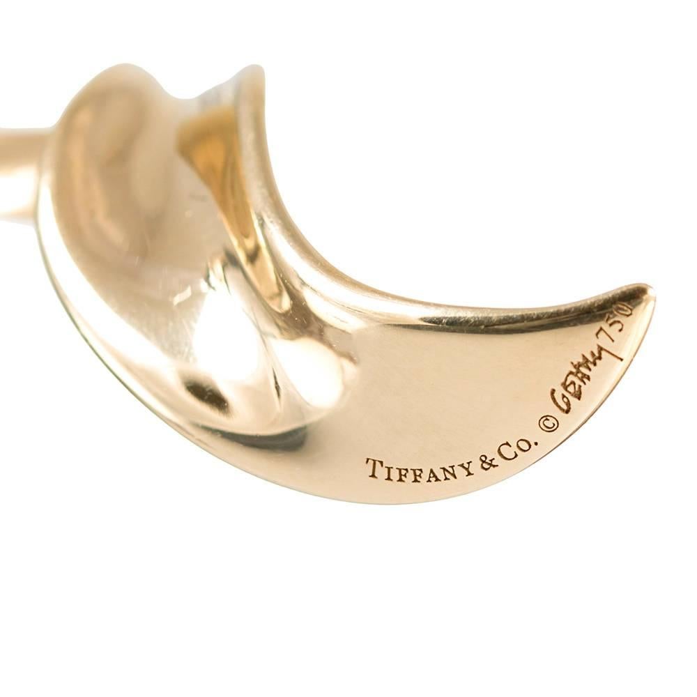 High polished golden spirals of gold drop 3.25 inches from your ear, catching the light as they move about. Designed by Paloma Picasso and made of 18 karat yellow gold by Tiffany & Co.