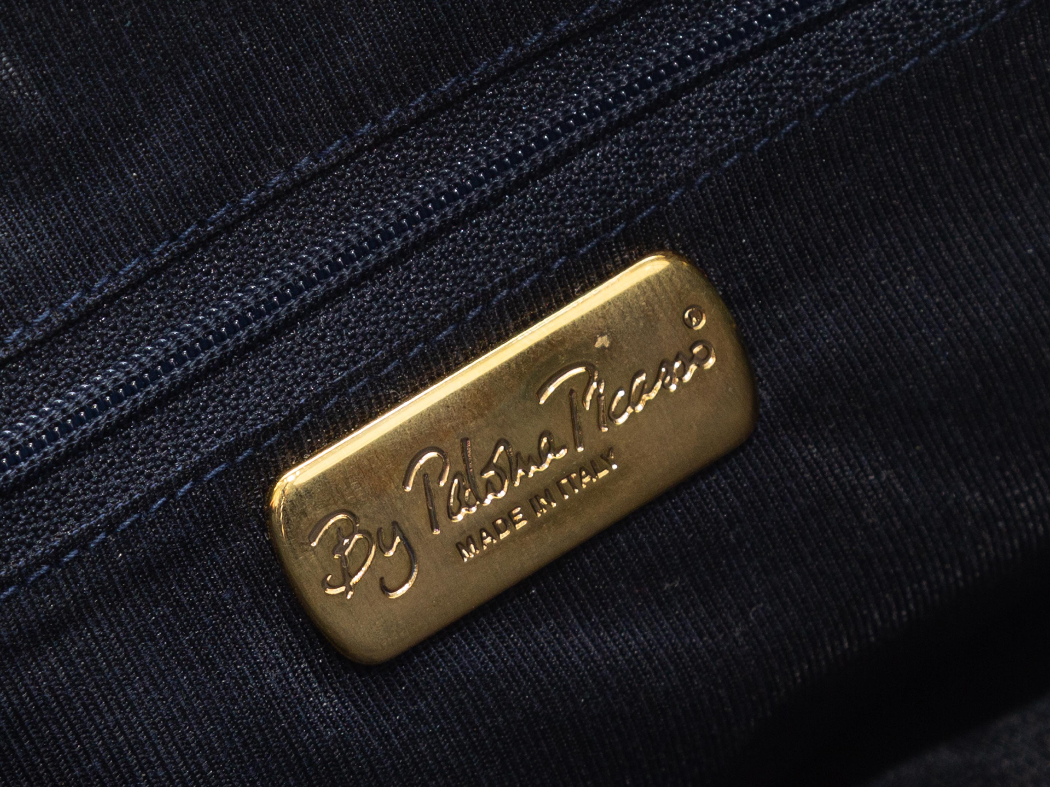 Product details: Vintage navy nylon shoulder bag by Paloma Picasso. Interior zip pocket. Adjustable shoulder strap. Closure at front flap. 13