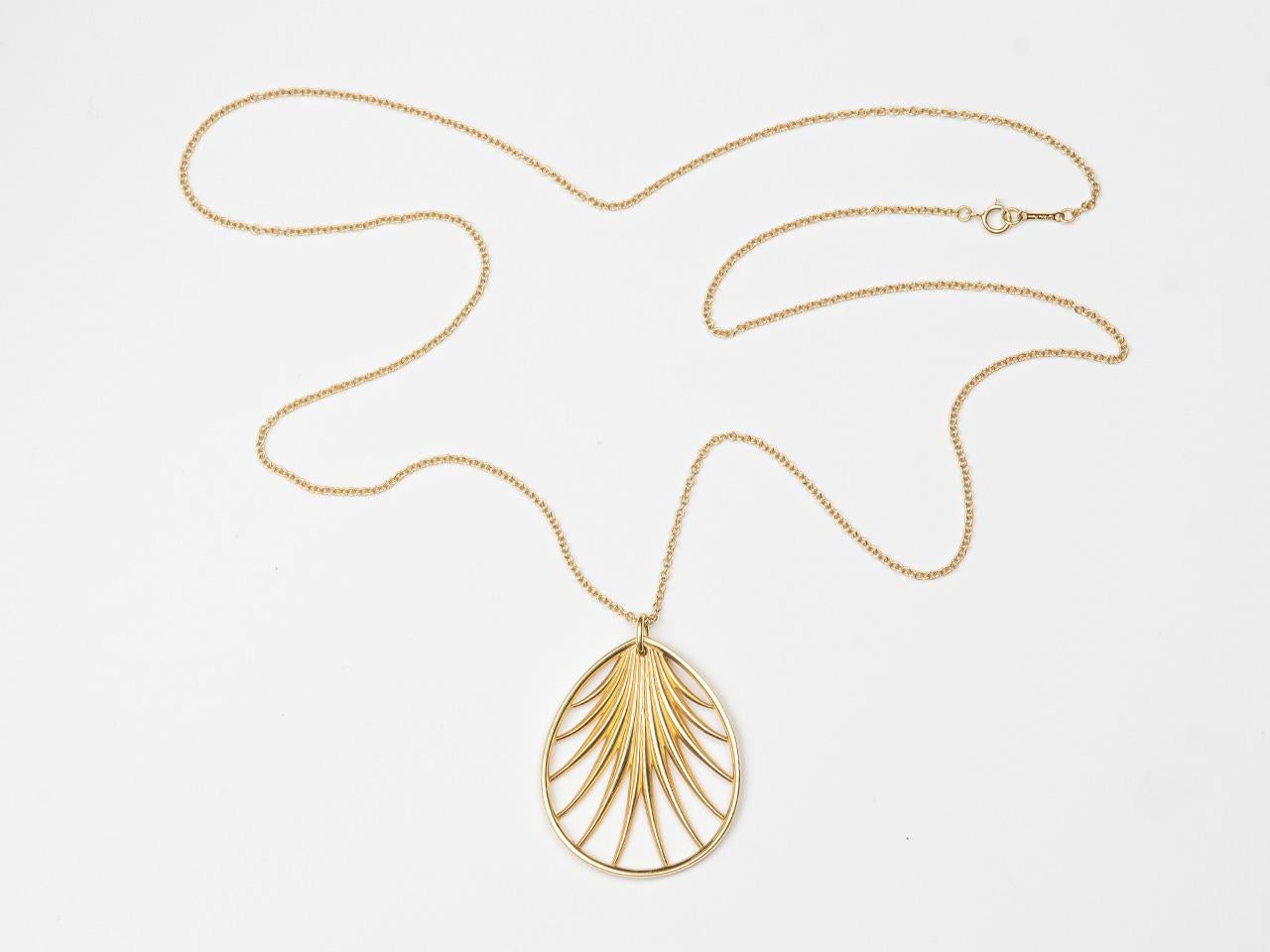 18k gold  16 inch chain suspending a stylized palm frond. Signed PALOMA  PICASSO TIFFANY & CO. 750 AU ITALY.