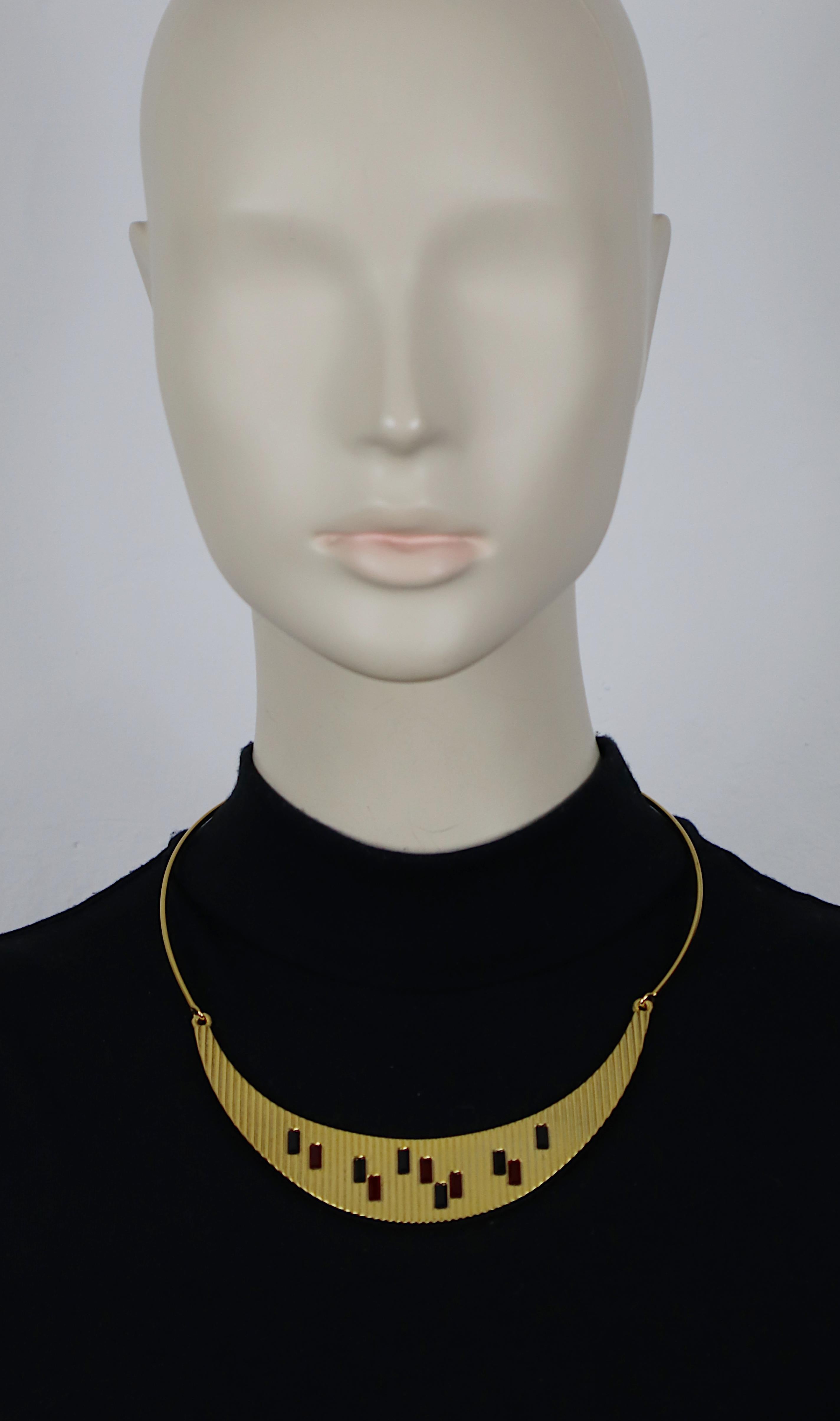 PALOMA PICASSO Parfums vintage gold tone ribbed design necklace embellished with ruby and jet black baguette shaped crystals.

Reference : Bijoux Promotionnels de Parfumeurs - Nicole & Mick Duprat - Editions ARFON - 2000 - Page 169 (brooch form the