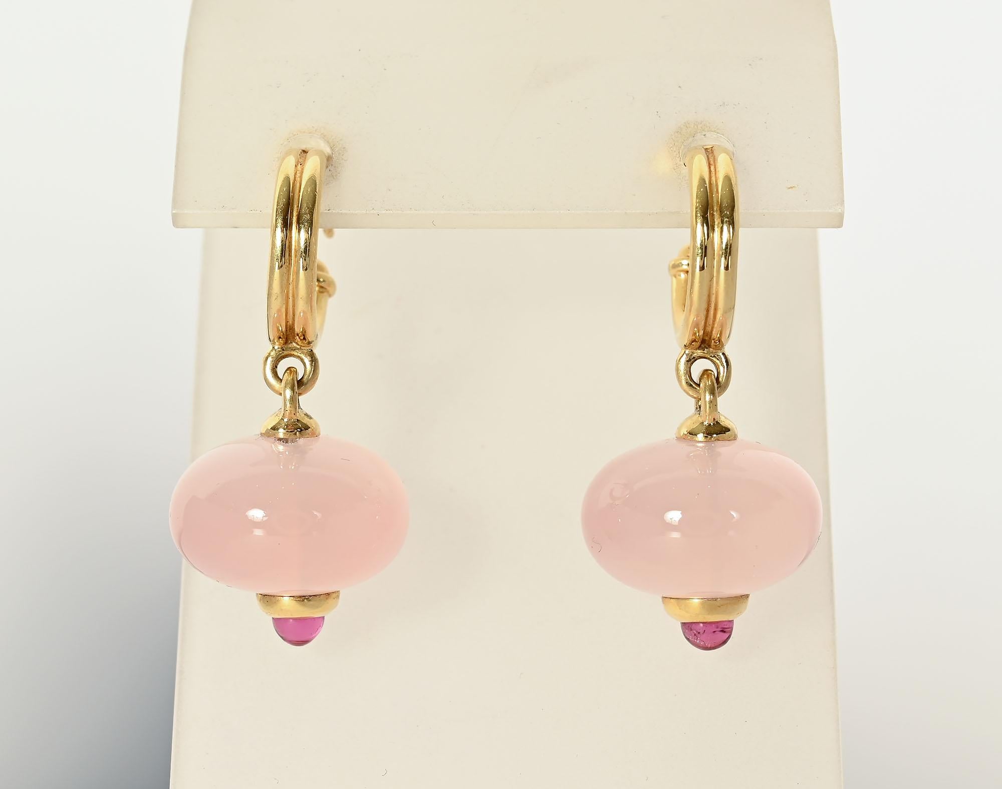 Rose quartz balls drop from a double hoop in these lovely earrings by Paloma Picasso. A tourmaline set in a gold collar completes the bottom. Post backs; like new condition. Measurements are 1 1/2