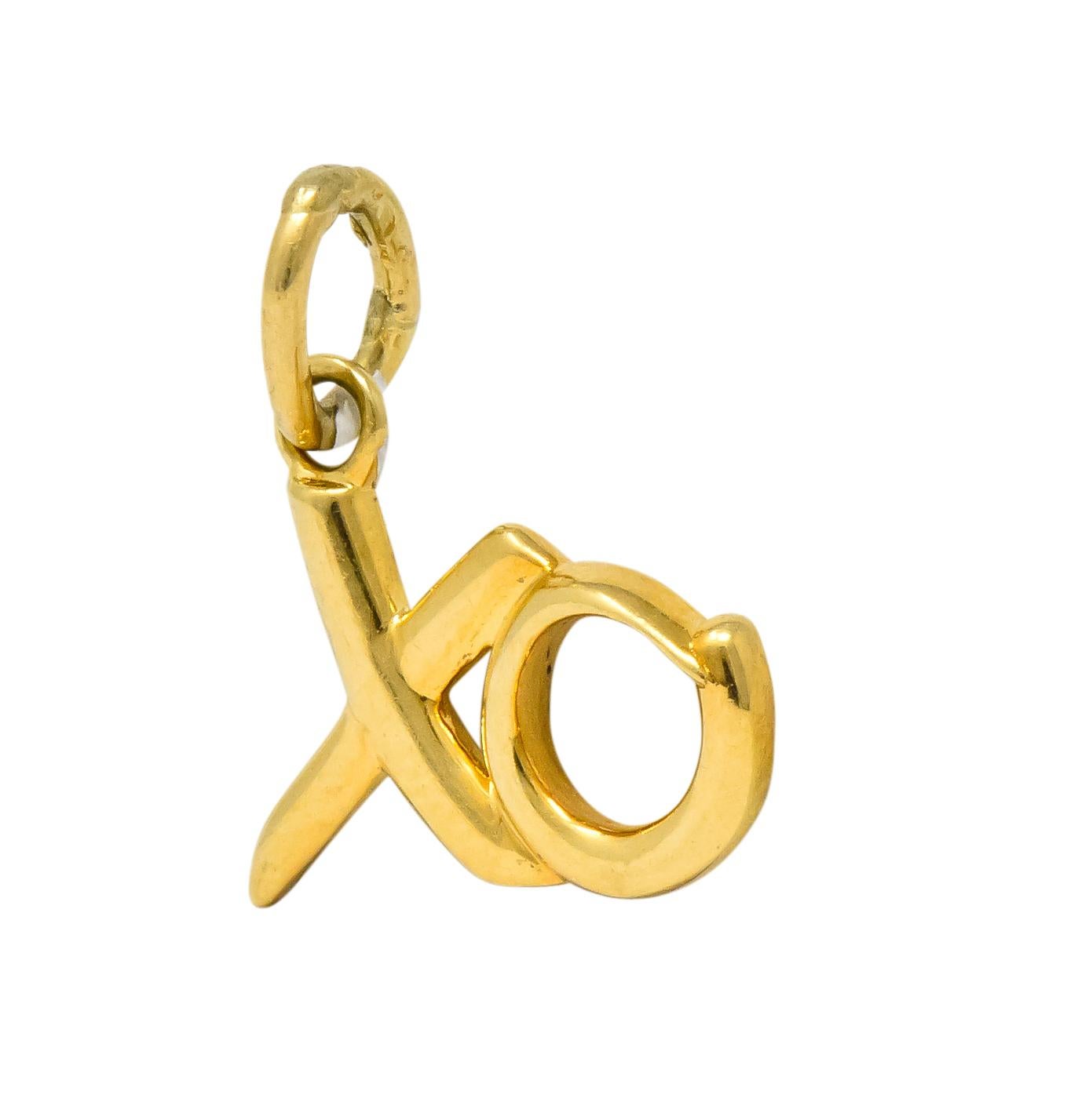 Featuring a conjoined stylized pierced X and O, Love and Kisses pendant

From the Paloma Picasso Graffiti collection

In highly polished 18 karat gold

Signed Paloma Picasso T & Co. 750 (for 18 karat gold)

Measures 15 mm x 11 mm

Total weight: 1.7