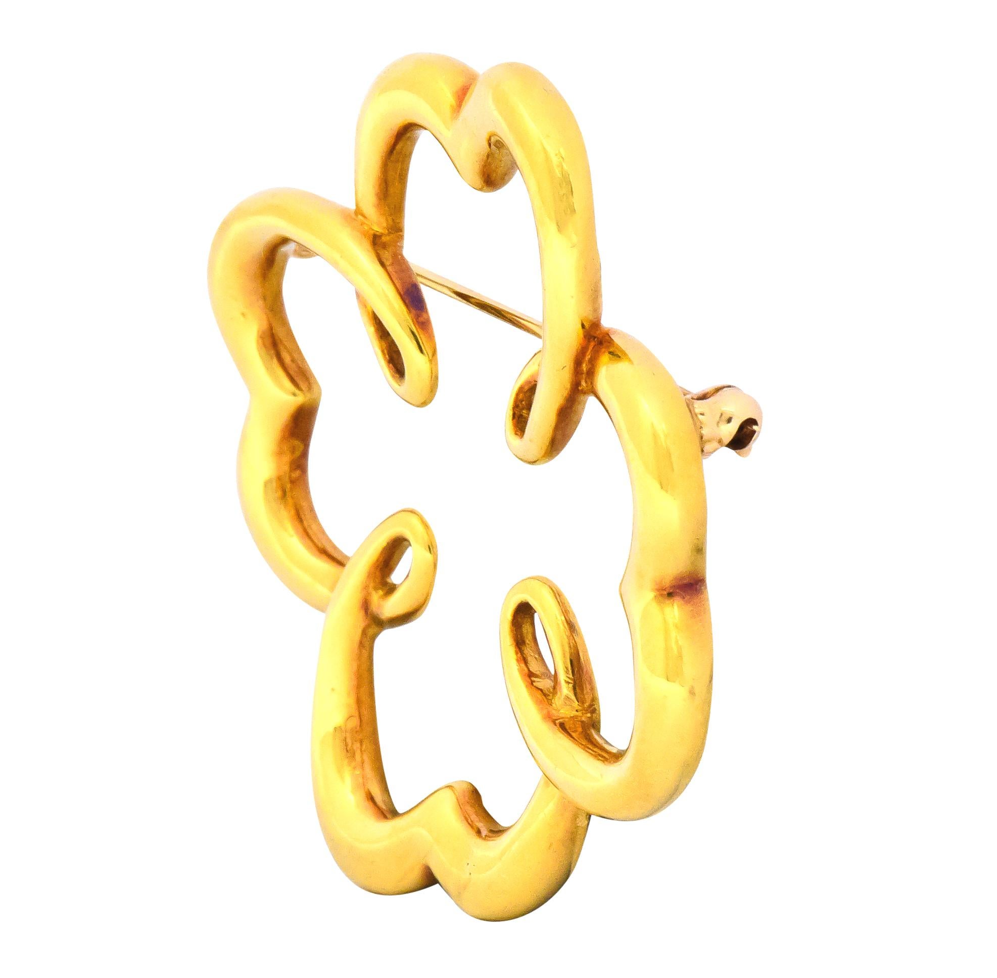 Designed as a stylized quatrefoil motif with sweetly swirled details

With a bright finish

Fully signed Paloma Picasso 1981 and T & Co. for Tiffany & Co.  

Stamped 18K for 18 karat gold

Circa: 1981

Measuring: 1 3/4 x 1 3/4 inches

Total weight: