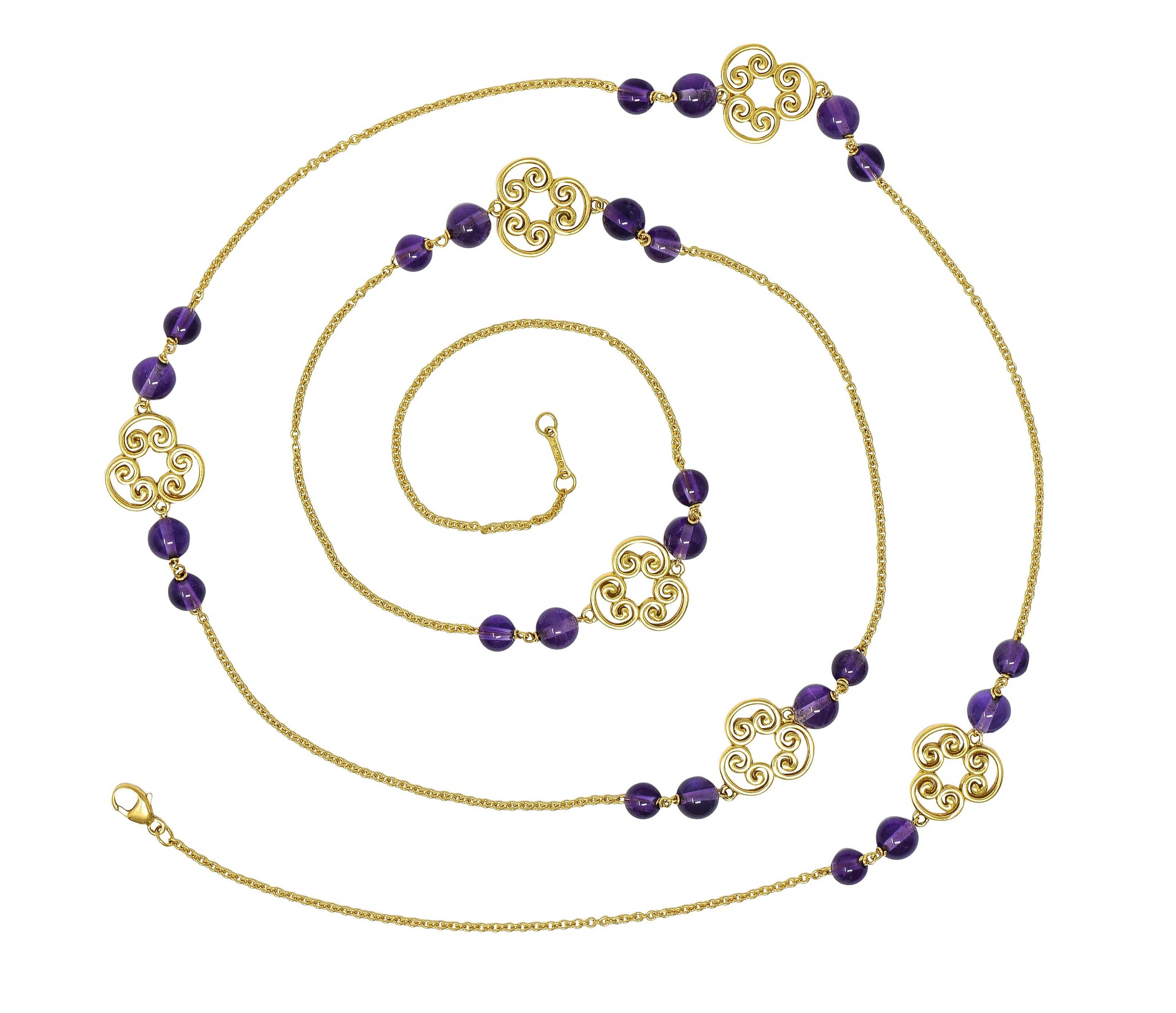 Designed as 1.5 mm cable link chain with six pierced 'Venezia' motif stations
Comprised of three joined scrolling whiplash motif forms  
Flanked by round amethyst beads ranging from 5.0 to 6.0 mm round
Transparent medium purple in color 
Completed