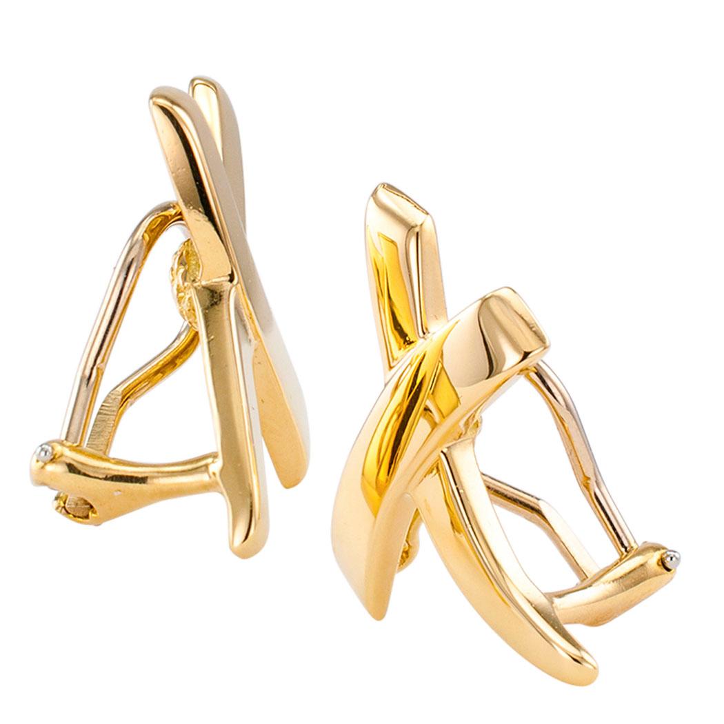 Paloma Picasso Tiffany & Co X yellow gold earrings circa 1980. Paloma Picasso’s X earring design for Tiffany & Co. crafted in 18-karat yellow gold with omega clip backs. We love the asymmetrical, stylish and witty look of these classic Paloma