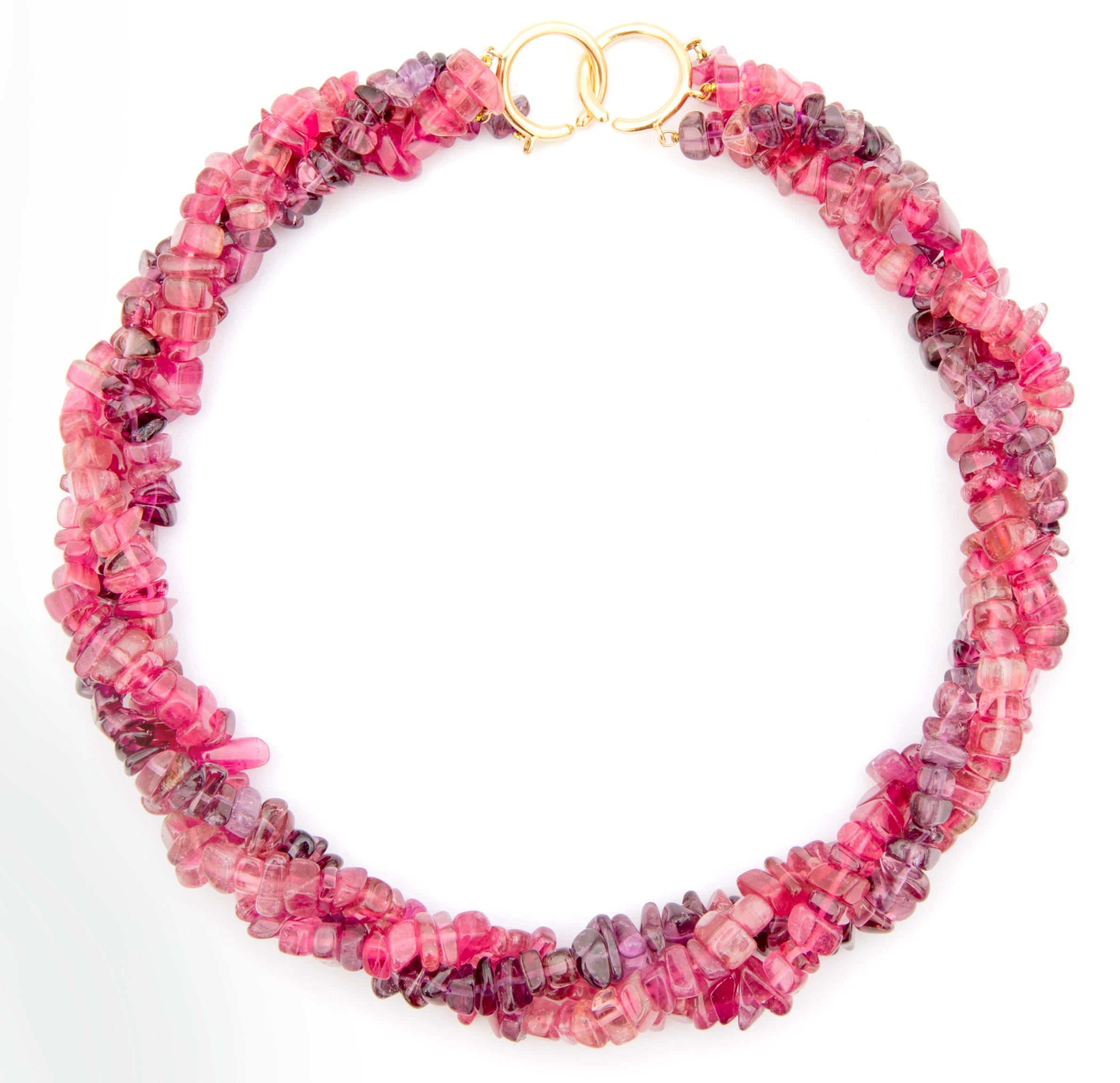 A gorgeous three strand necklace in pink and purple shades of tourmaline, this creation by Paloma Picasso for Tiffany and Co. is truly stunning. It is designed as a series of vary-shape pink and purple tourmaline beads and can be worn straight or