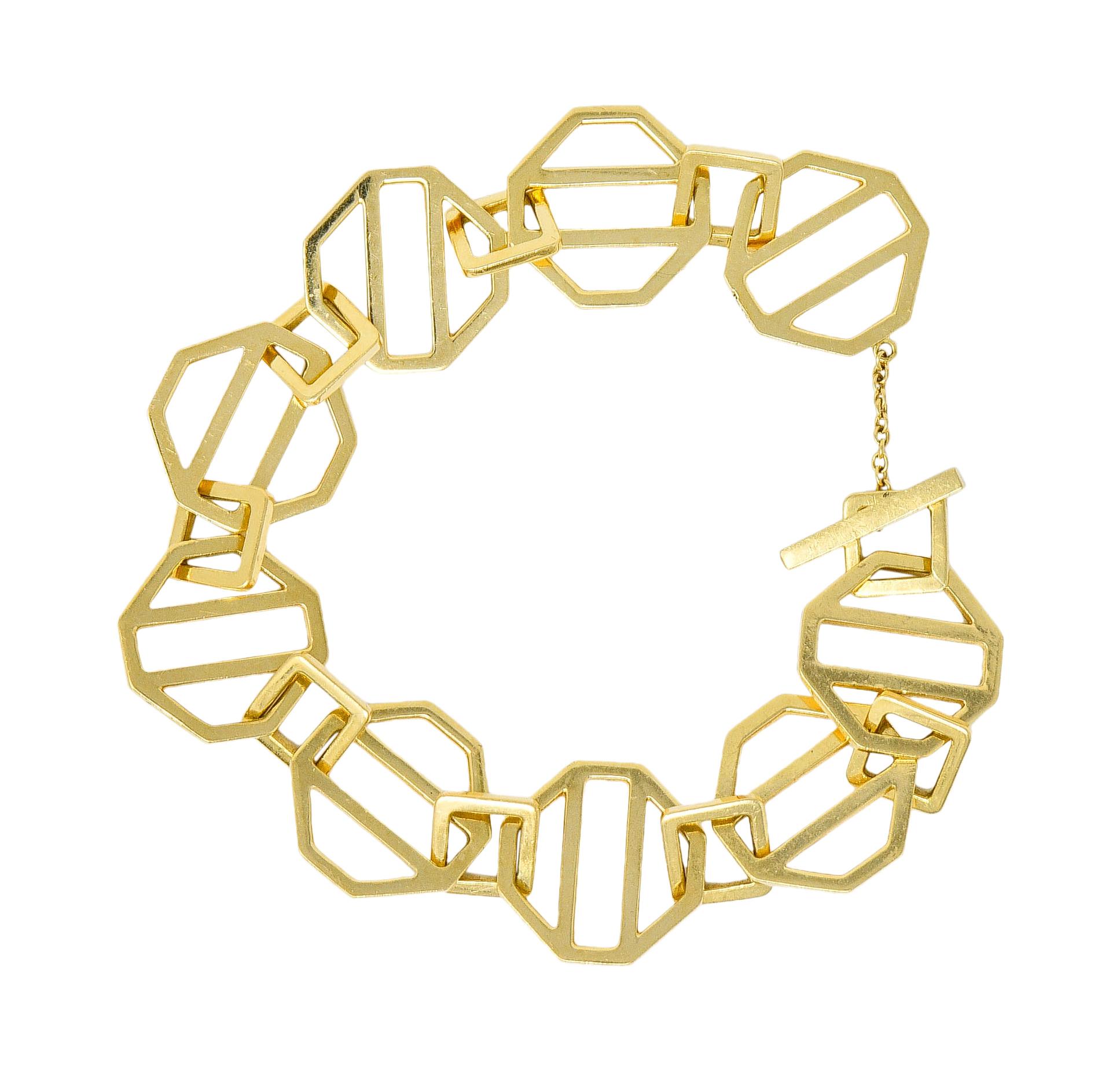 Bracelet is comprised of striated octagonal links

Alternating with smaller square cushion spacer links

Completes at a bar toggle clasp with safety chain

Signed Paloma Picasso and T & Co.

Stamped 750 for 18 karat gold

Circa: 1980s

Length: 7 1/2