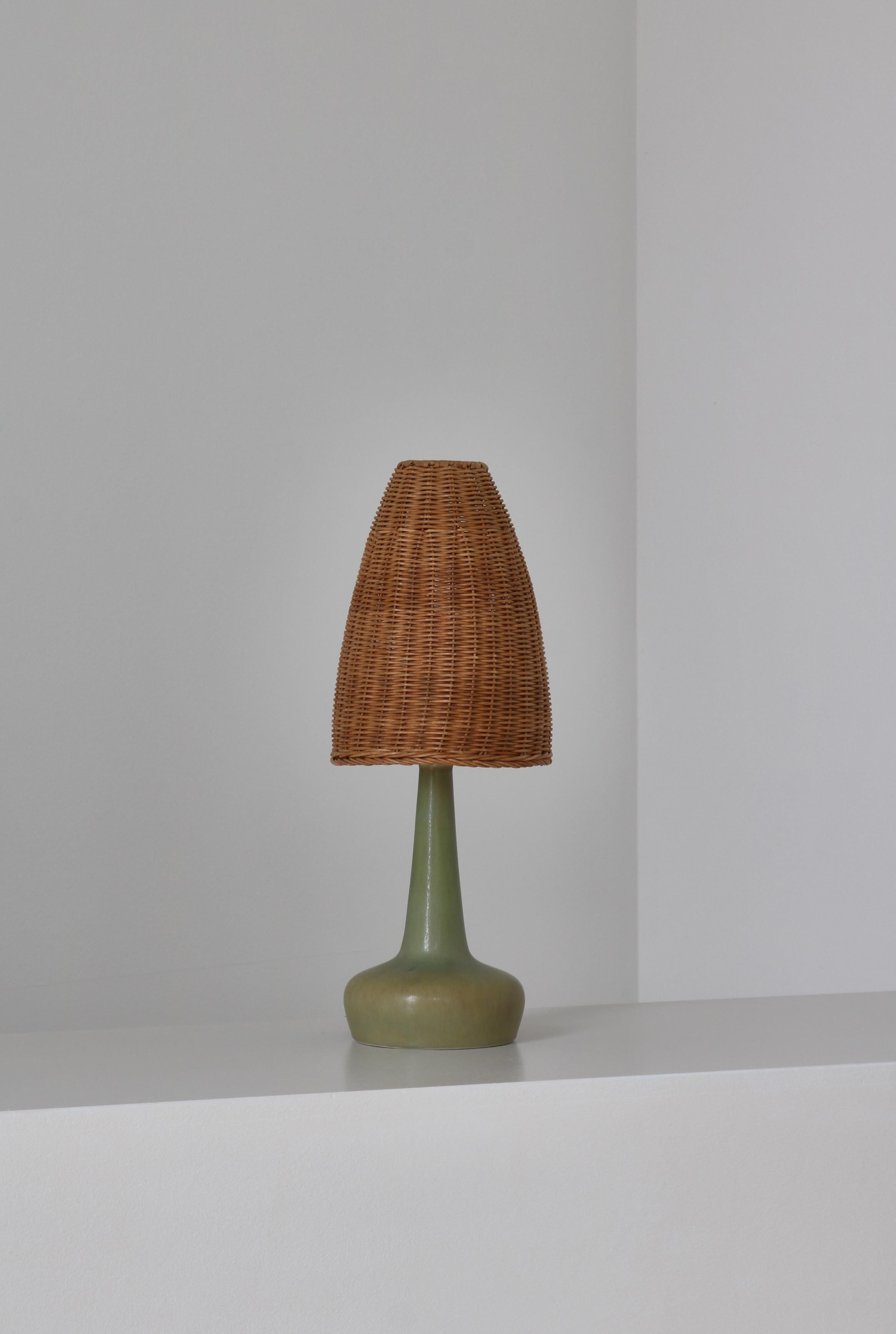 Wonderful table lamp model no. 311 designed by Esben Klint in 1949 for Le Klint, Denmark. This stoneware edition was handmade at Palshus Stentøj, Copenhagen in the 1950s in commission for Le Klint. This one is decorated in the rare 