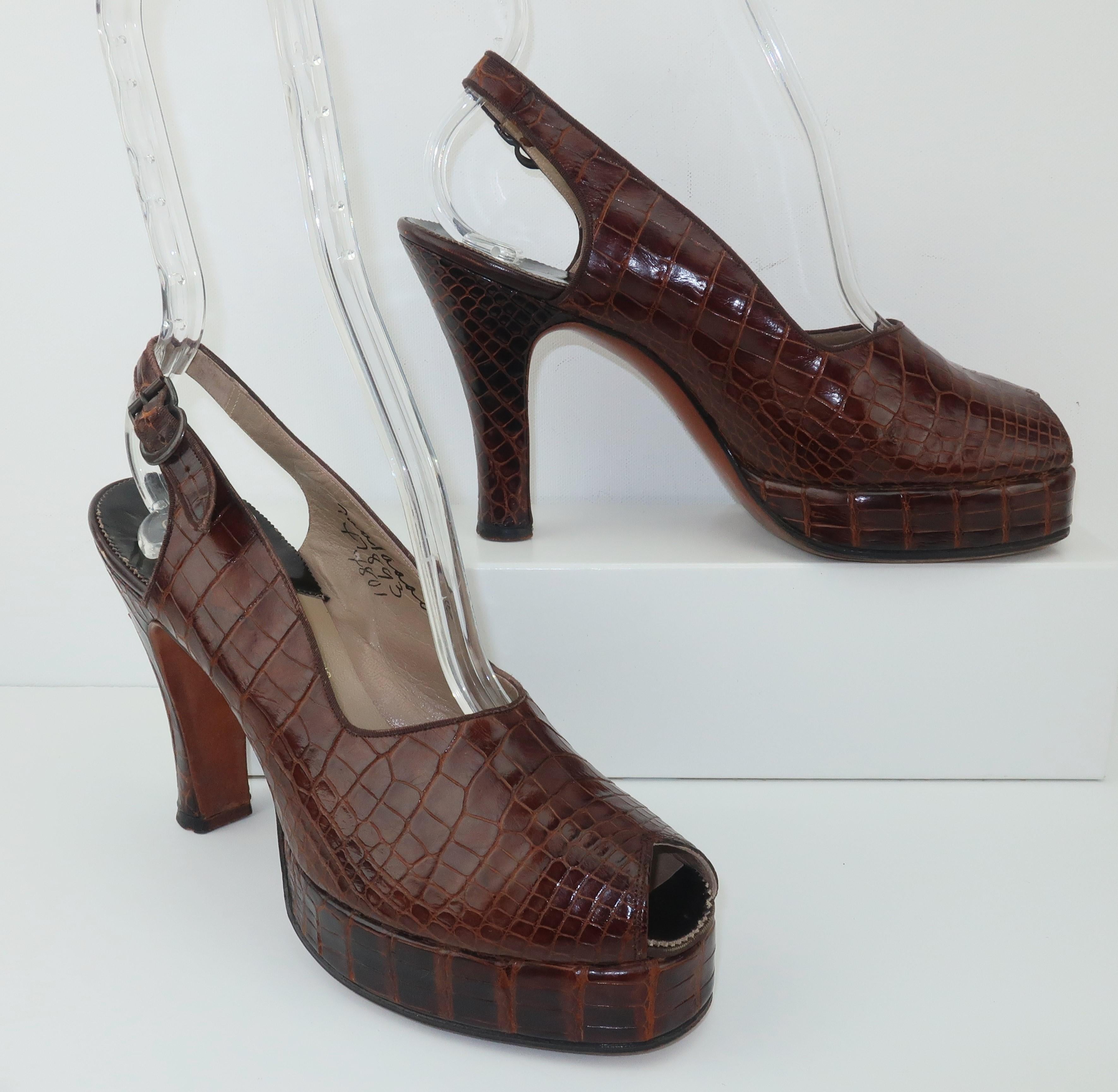Someone time traveled from the 1970's to the 1940's or vice versa. One thing is for sure, these fabulous alligator peep toe platform shoes by Palter DeLiso would be equally stylish in any era. Fully constructed in brown alligator with leather soles,