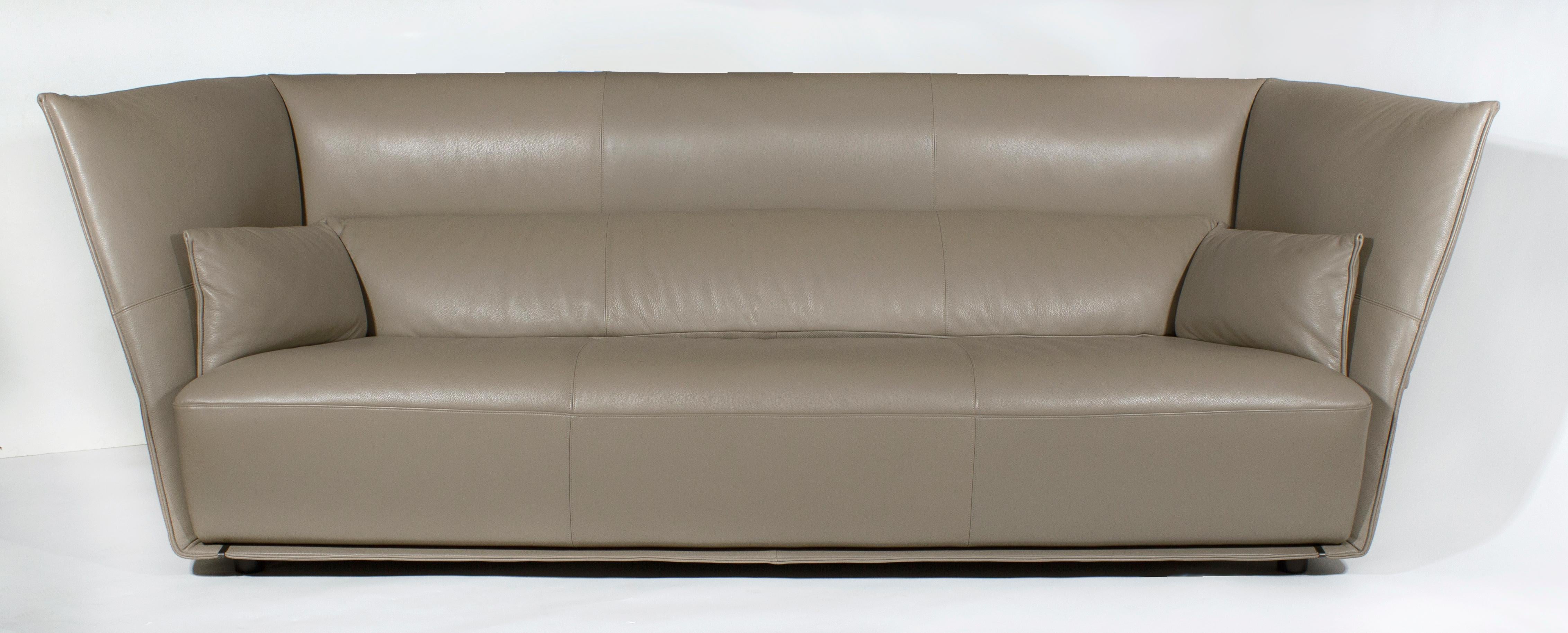 Extraordinarily comfortable sofa that hugs you in all the right places and encompasses the whole body creating a seating environment. The full grain leather upholstery is soft to the touch and is in either the SC34 Maggese or SC40 Cachemire
