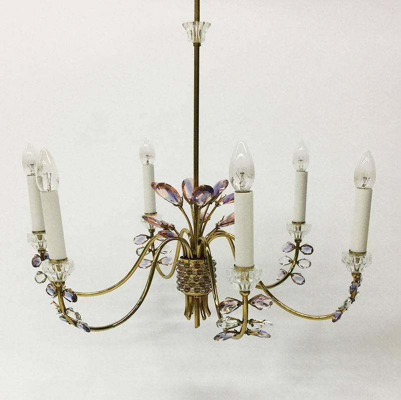 Germany Chandelier, Brass and Faceted Crystals by Palwa, 1970s

A beautiful brass gold plated with colored faceted crystals chandelier,
Manufactured in the 1970s by Palwa Germany.
The measurements are 96 cm high and the diagonal is 66 cm




