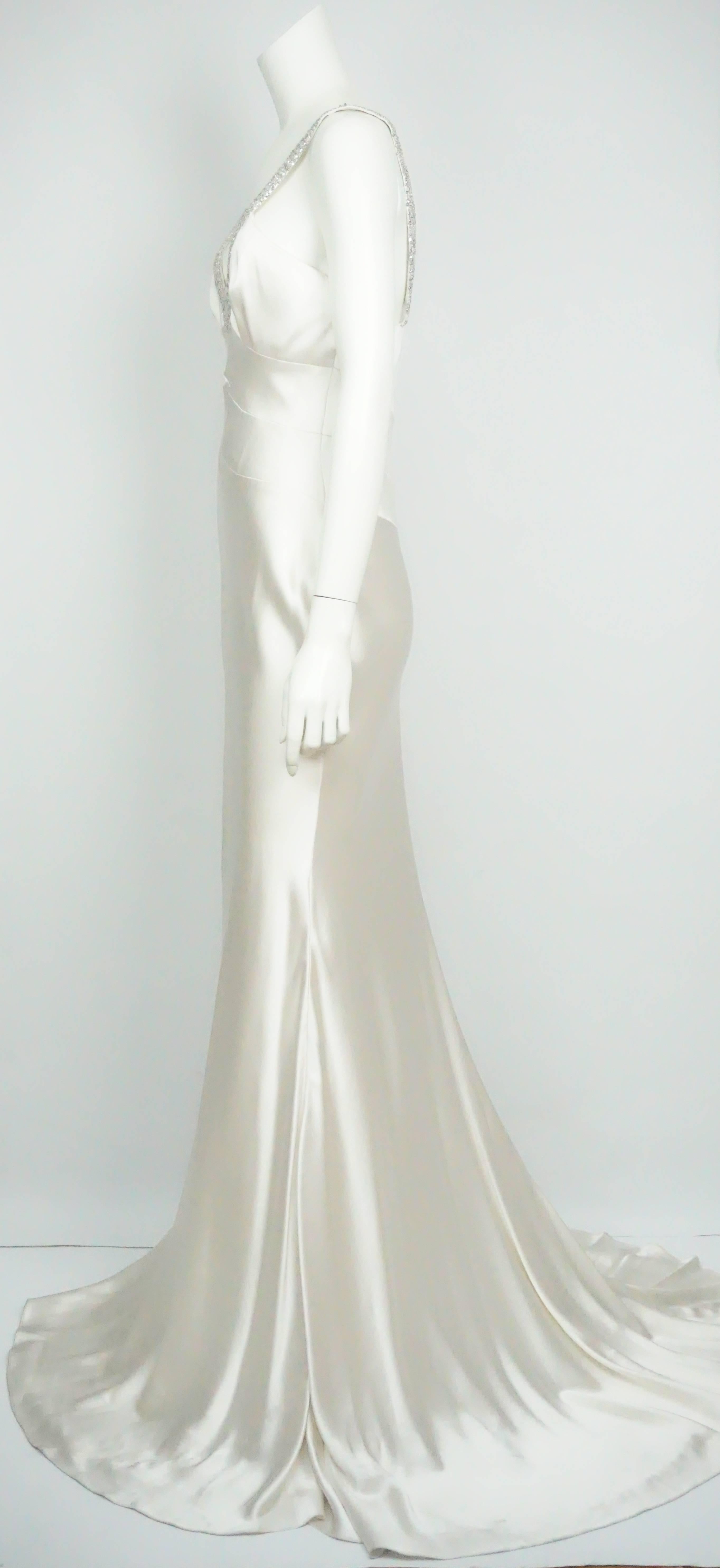 Pamela Dennis Ivory Silk Gown w/ Rhinestone Straps - 8 This gorgeous ivory gown is completely silk. It has a silk lining, fitted to the waist line, comes out in an A-line, the straps are about 1
