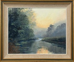 A serene river landscape at dawn with misty trees and soft, warm morning light