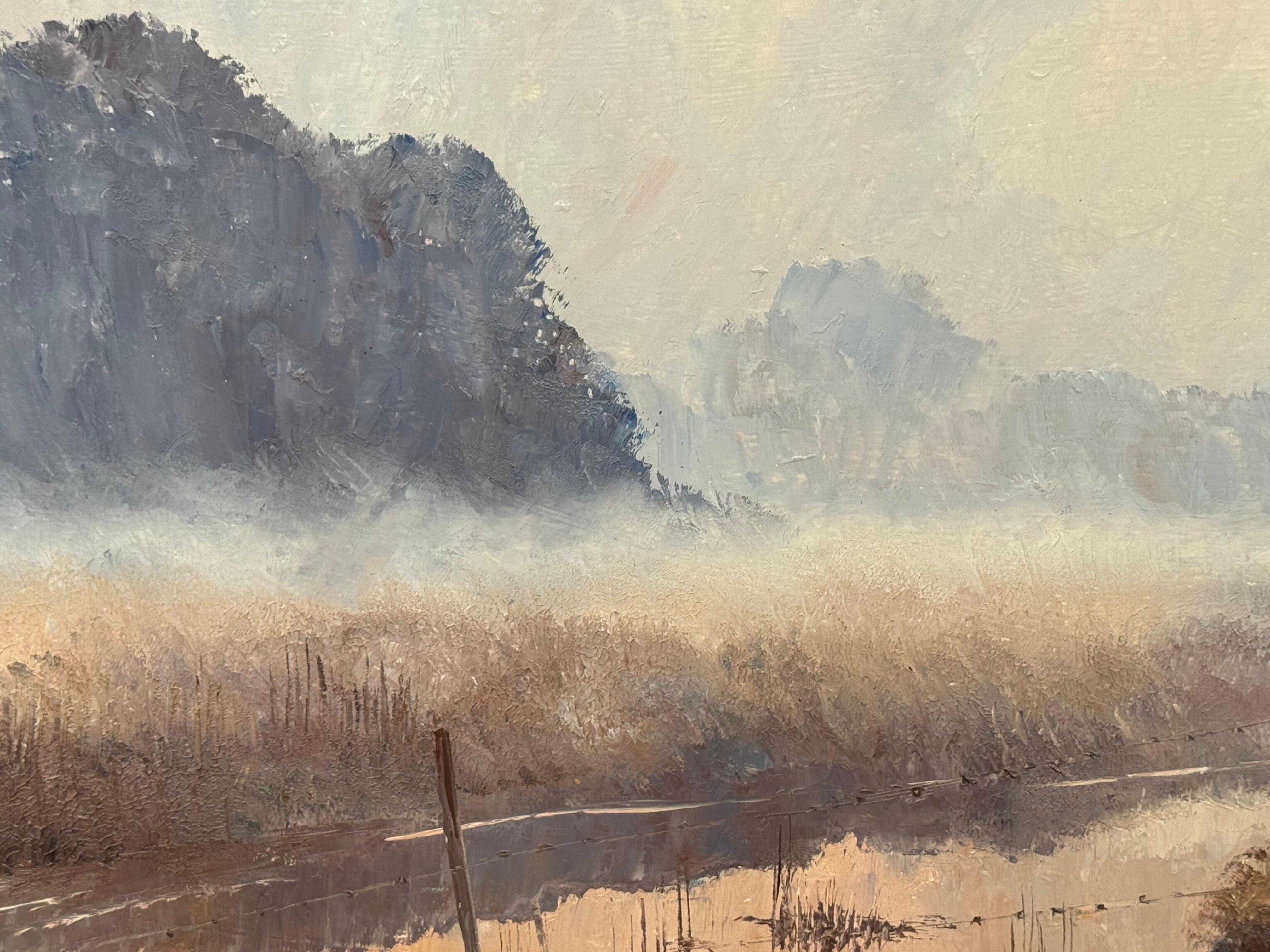 A serene river landscape at dawn with misty trees and soft, warm morning light For Sale 13