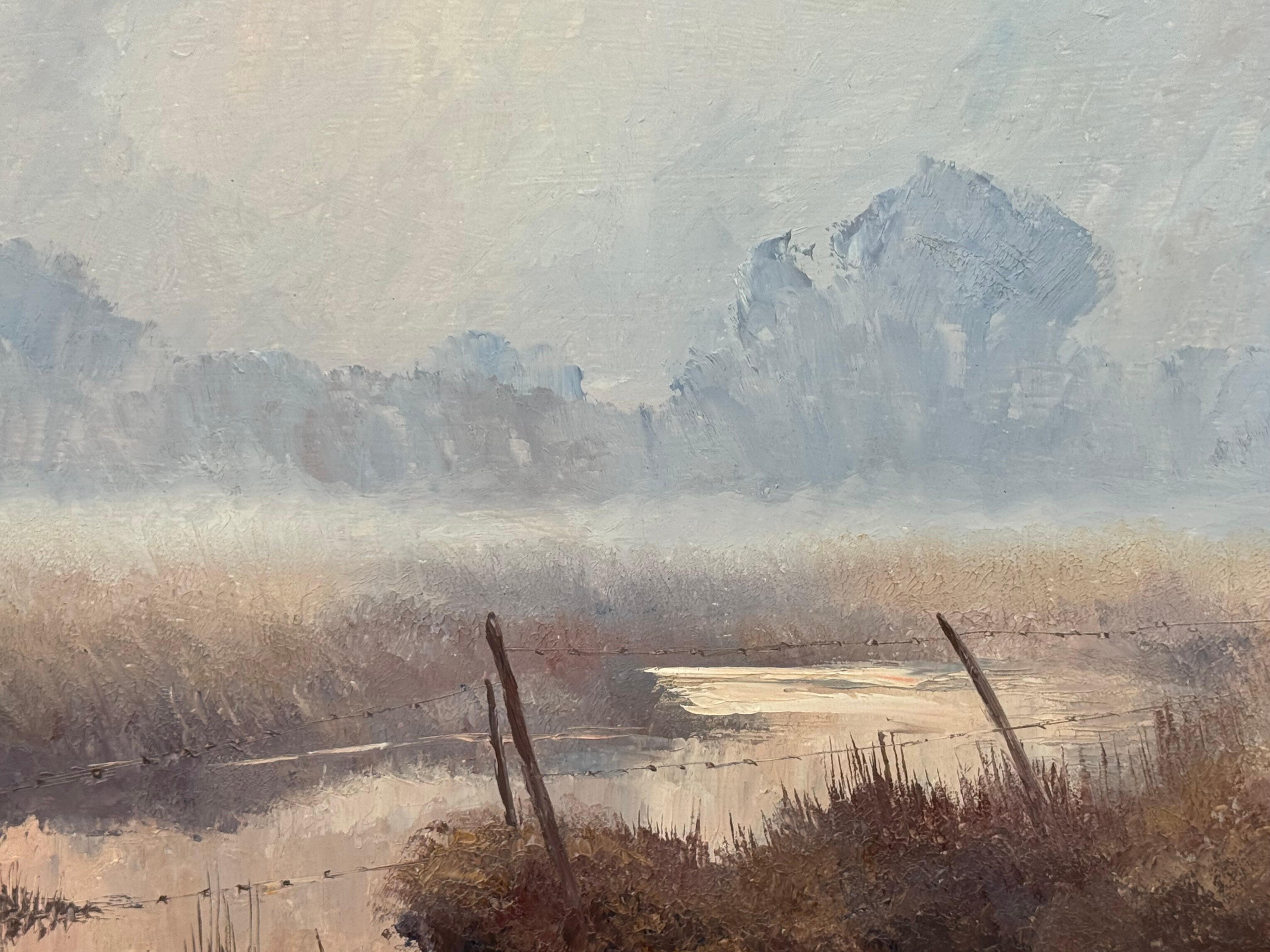 A serene river landscape at dawn with misty trees and soft, warm morning light For Sale 4