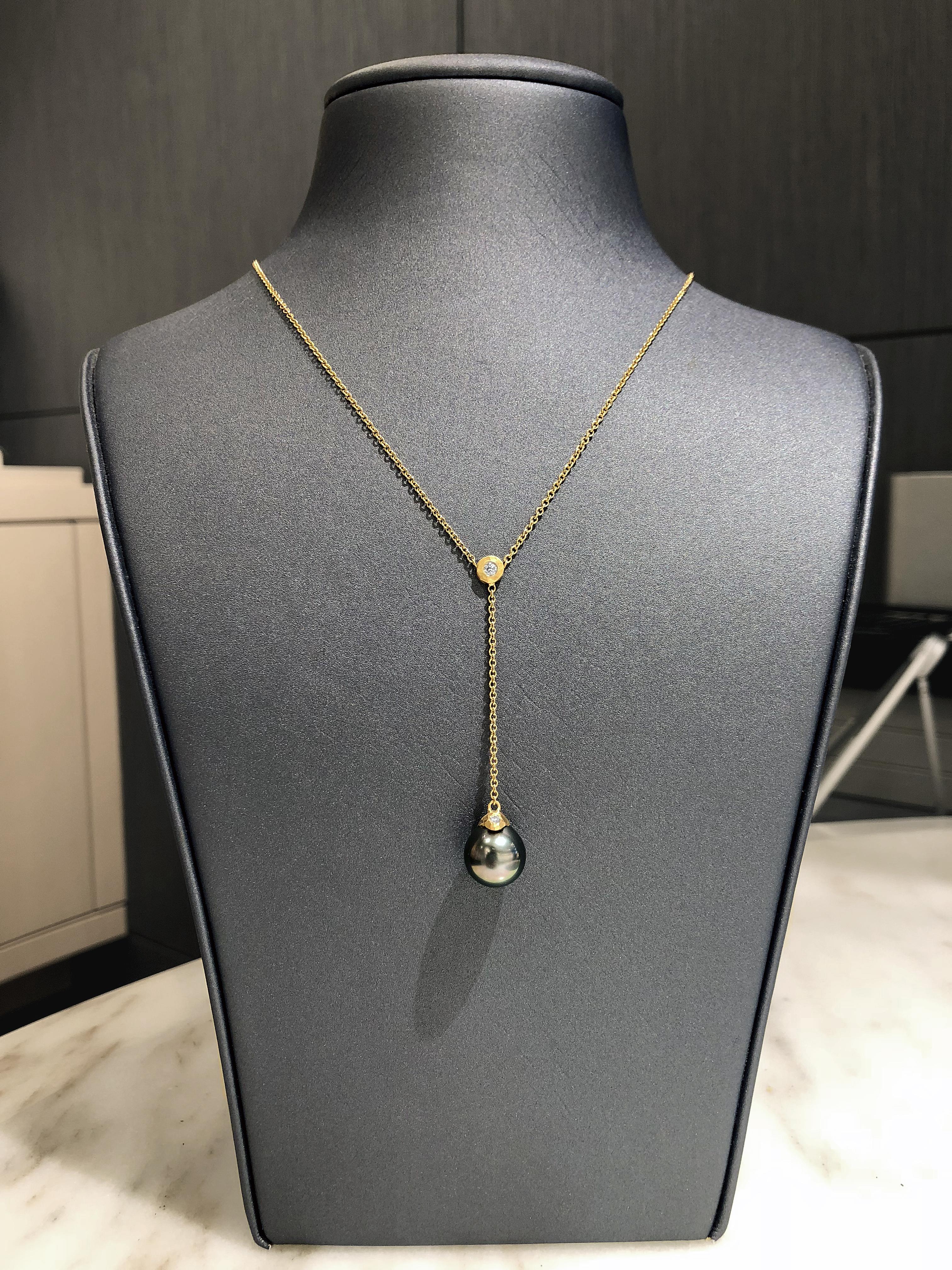 One of a Kind Drip Cap Lariat Necklace handcrafted by award winning jewelry artist Pamela Froman in her signature-finished, hand-hammered 18k yellow gold featuring a spectacular, lustrous Tahitian pearl accented with two round brilliant-cut white