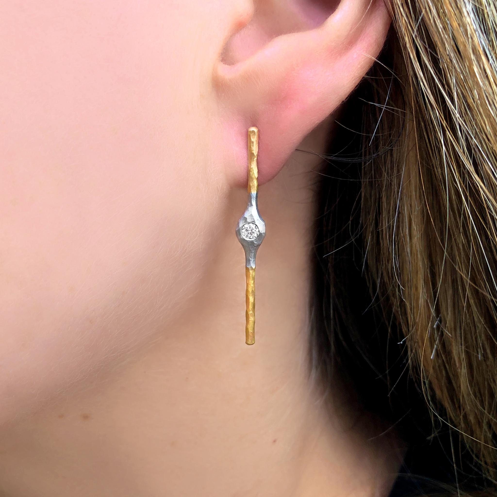 Diamond Stick Earrings handcrafted by jewelry maker Pamela Froman in hand-hammered and matte-finished 18k yellow gold featuring two round brilliant-cut white diamonds totaling 0.17 carats. Stamped and Hallmarked.

About the Maker - Pamela Froman,