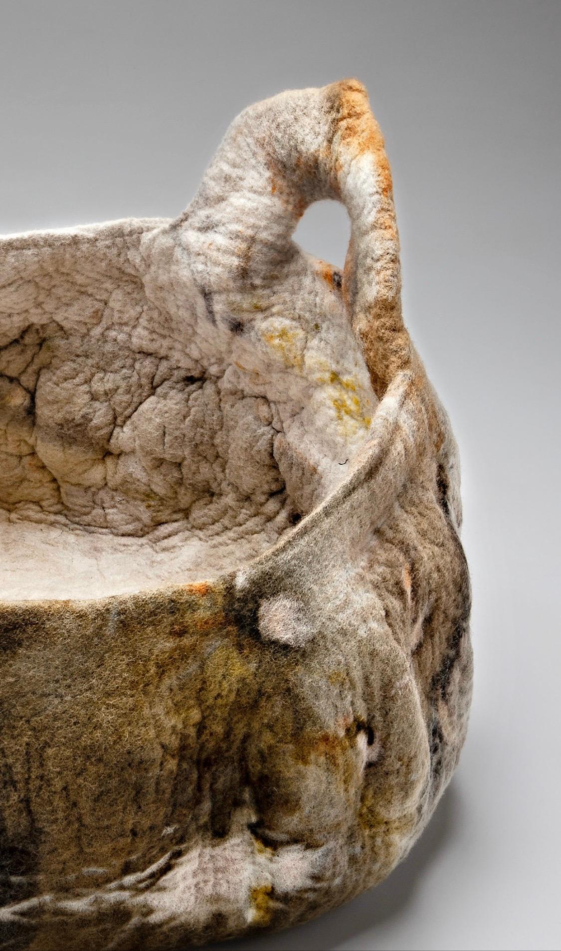 The contemporary textile designer Inês Schertel manufactures versatile items using a six thousand year old technique. Each piece is unique in color and form and are not woven as textiles in a loom, but, instead, felted through the friction of the