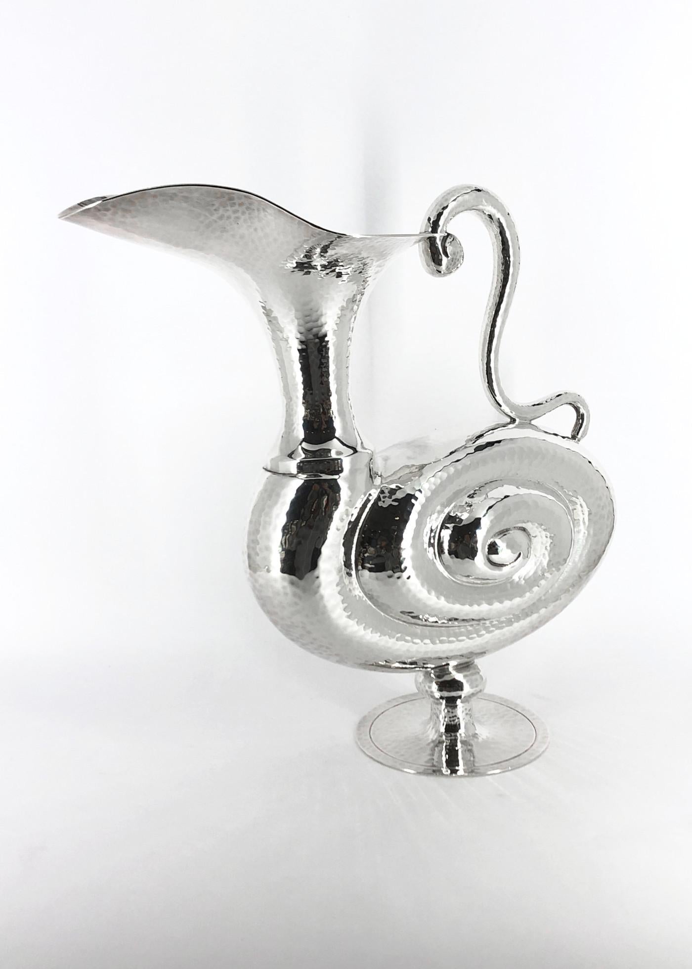 925/ooo silver pitcher made by Pampaloni Florence Italy, weight g 835, height cm 22, base diameter cm 8, width cm 24
Based on original sketches by Roman artist Giovanni Maggi from 1602.

Roman painter Giovanni Maggi was described as a man of
