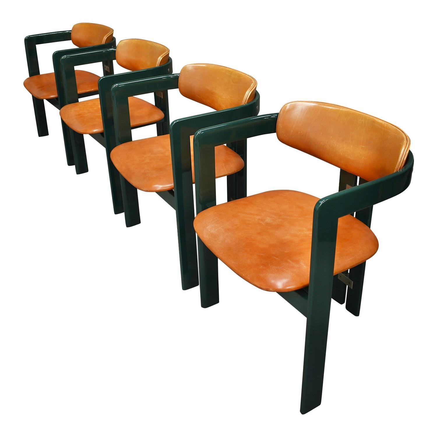 Rare set of green Pamplona chairs by Augusto Savini for Pozzi, Italy, 1965.

The chairs have a beautiful dark green high gloss lacquered bentwood base with amazing tan or cognac leather upholstery and solid aluminum details, all still original!