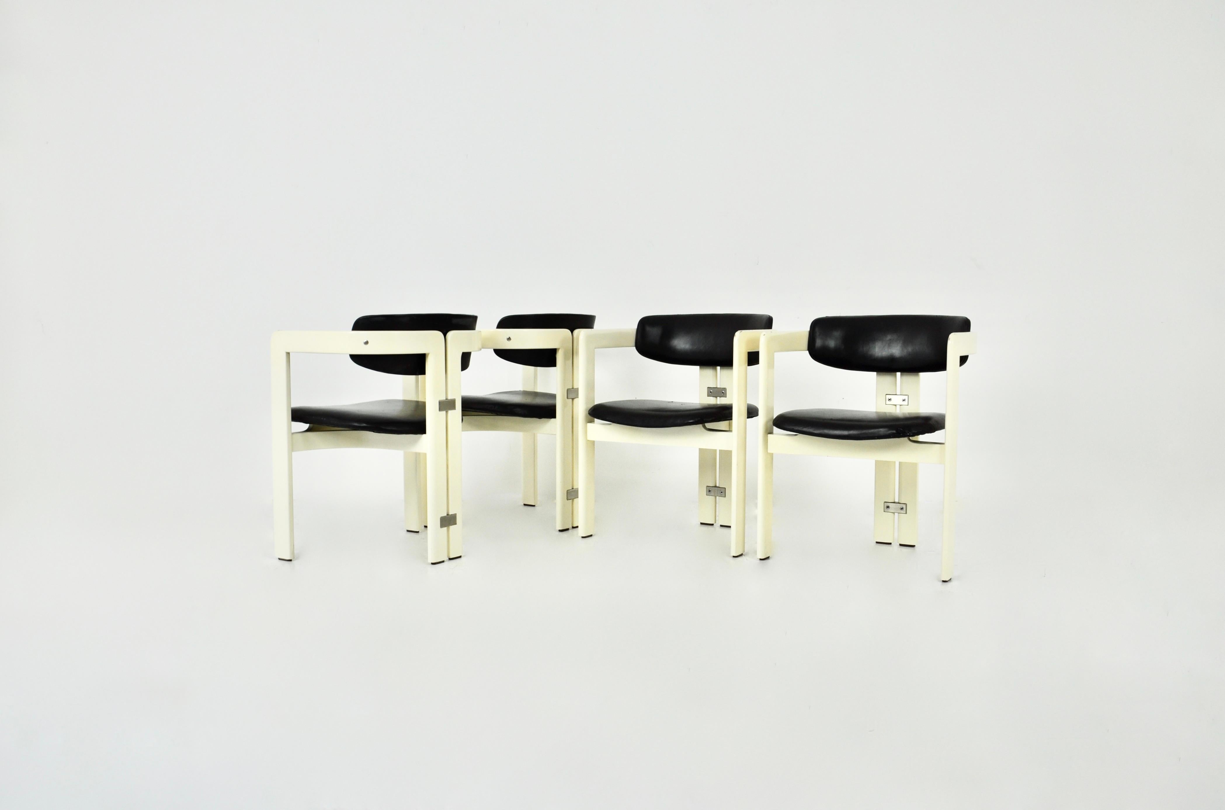 Set of 4 black and white wood and leather chairs by Augusto Savani for Pozzi. Seat height: 44 cm Wear due to time and age of the chairs.