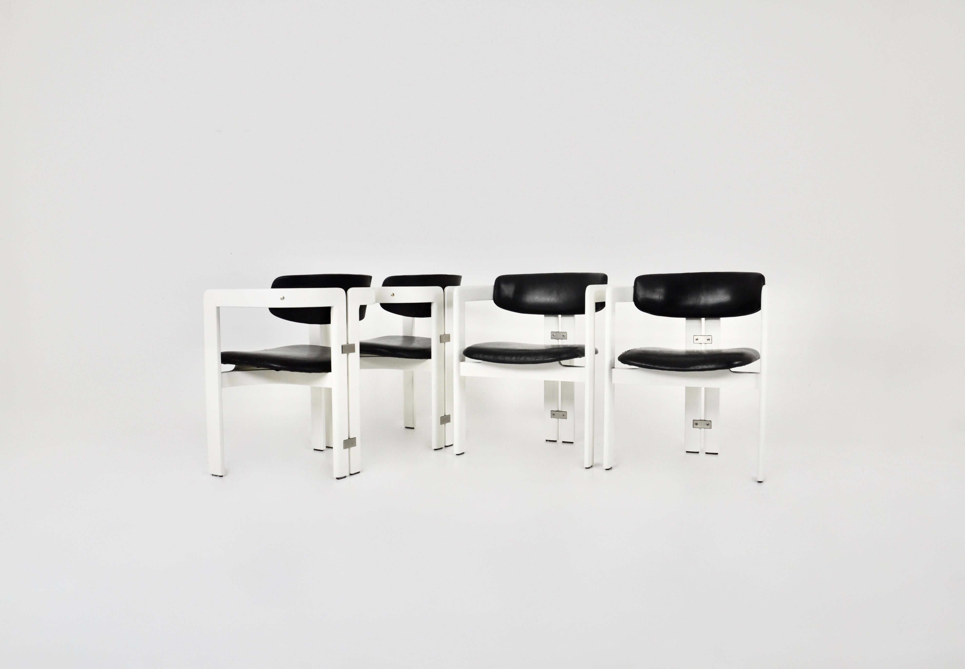 Set of 4 black and white wood and leather chairs by Augusto Savani for Pozzi. Model: Pamplona. Seat height: 44 cm Wear due to time and age of the chairs.