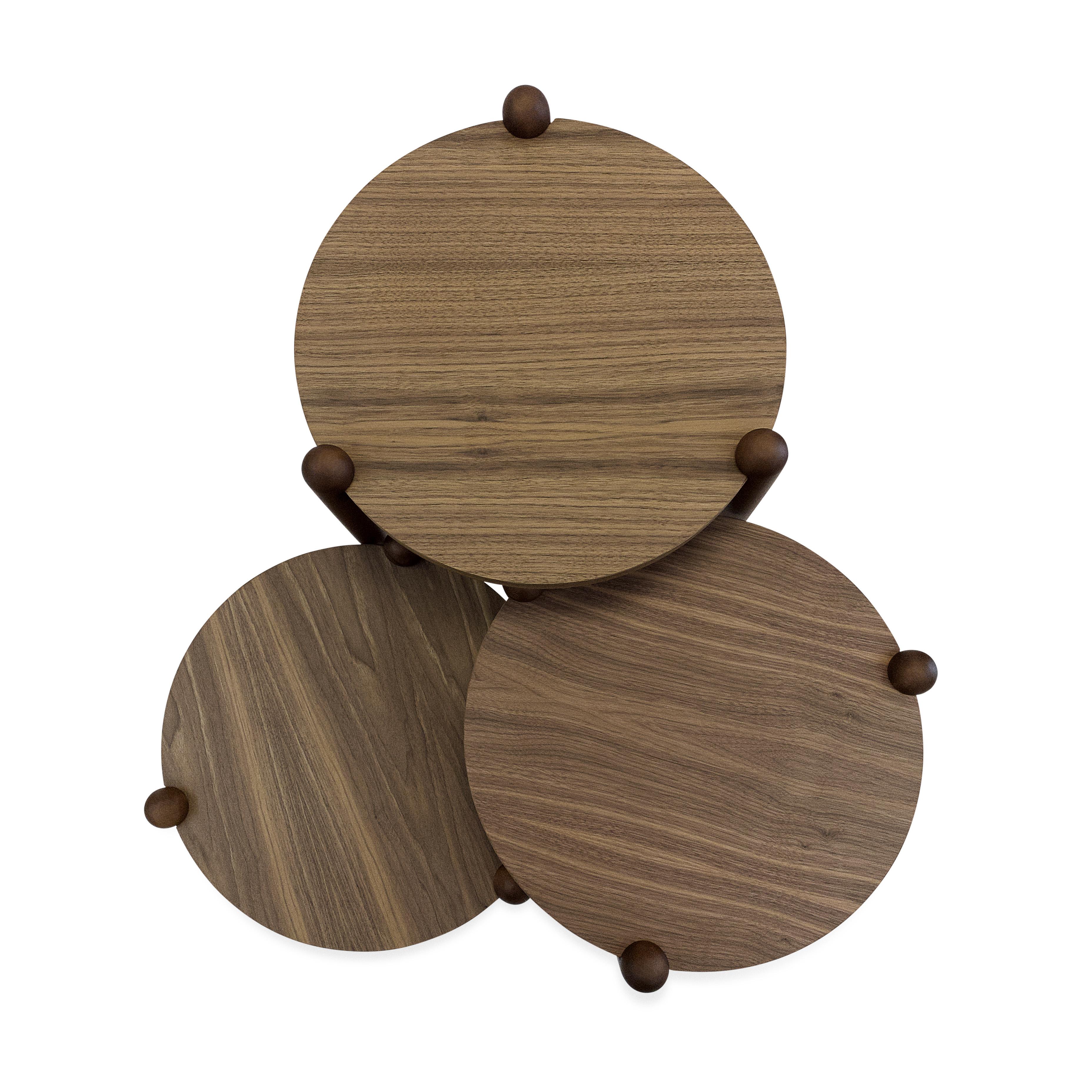 This beautiful set created by our amazing Uultis design team is a set of three occasional tables in a walnut wood finish with cone-shaped feet that gives a retro touch providing a sophisticated style that you will not regret having in your house.