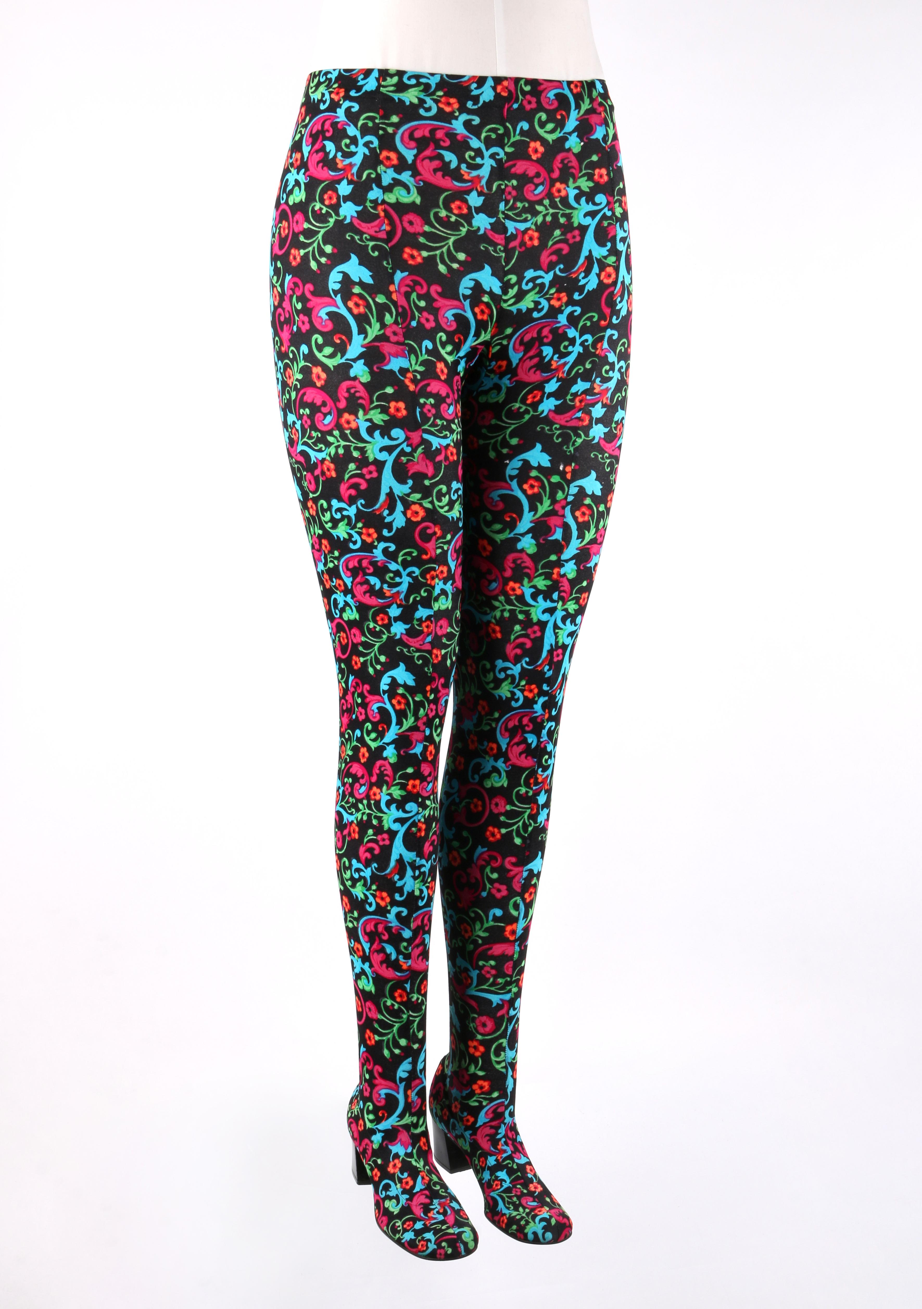DESCRIPTION: PAN-T-BOOTS c.1960s Floral Filigree Print Stretch High Waist Leggings Pant Boots
 
Circa: c.1960’s
Designer: Suzanne Garfield
Style: Leggings / Pant boots
Color(s): Multi in shades of black, teal blue, green, orange, red, and magenta.