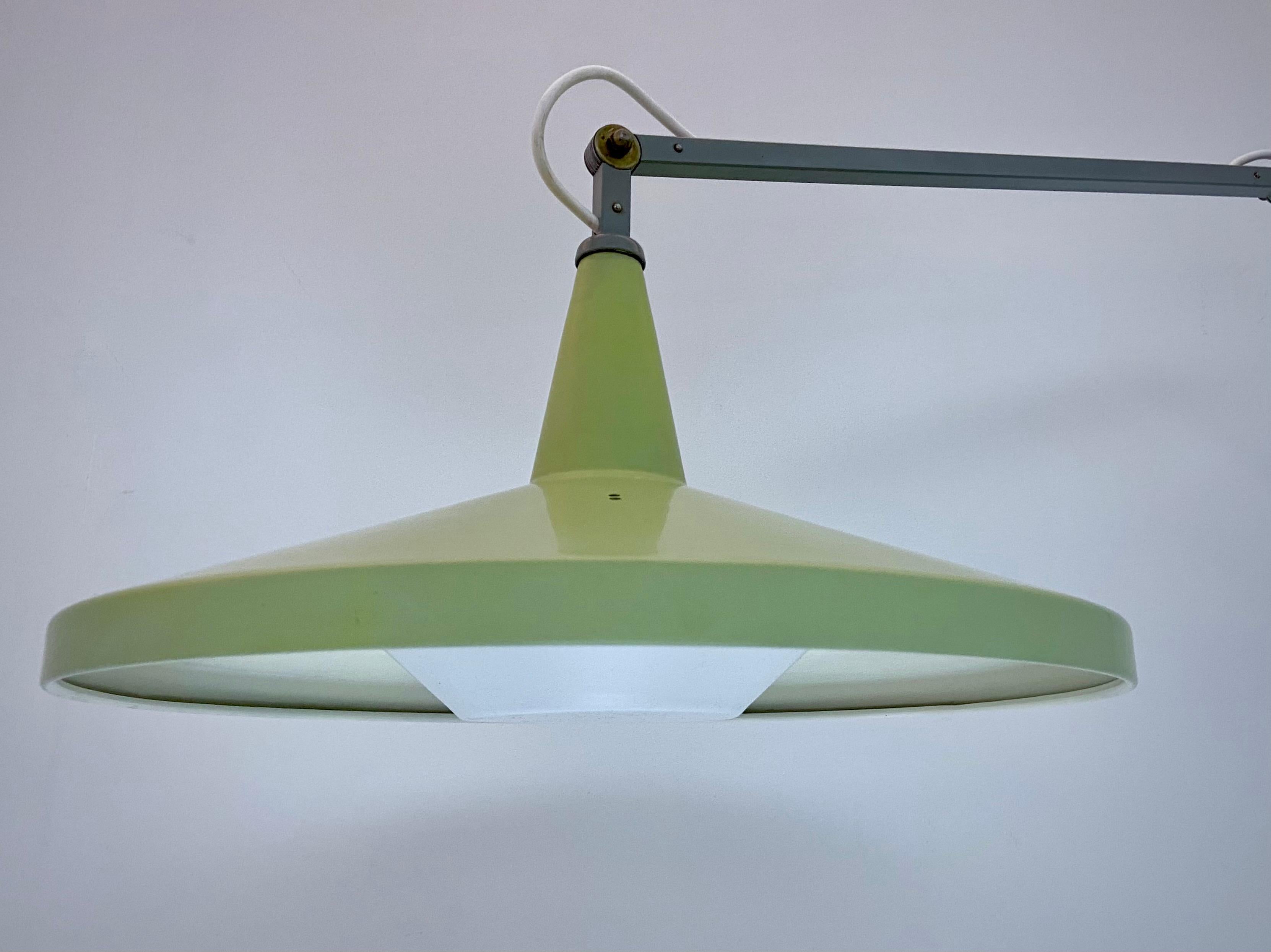 What makes this 'Panama' Lamp by Wim Rietveld so unique is that it is in a perfect original condition. The shade is still in the original lime green colour and has no dents or scratches. The diffuser is original too but for the picture we used a new