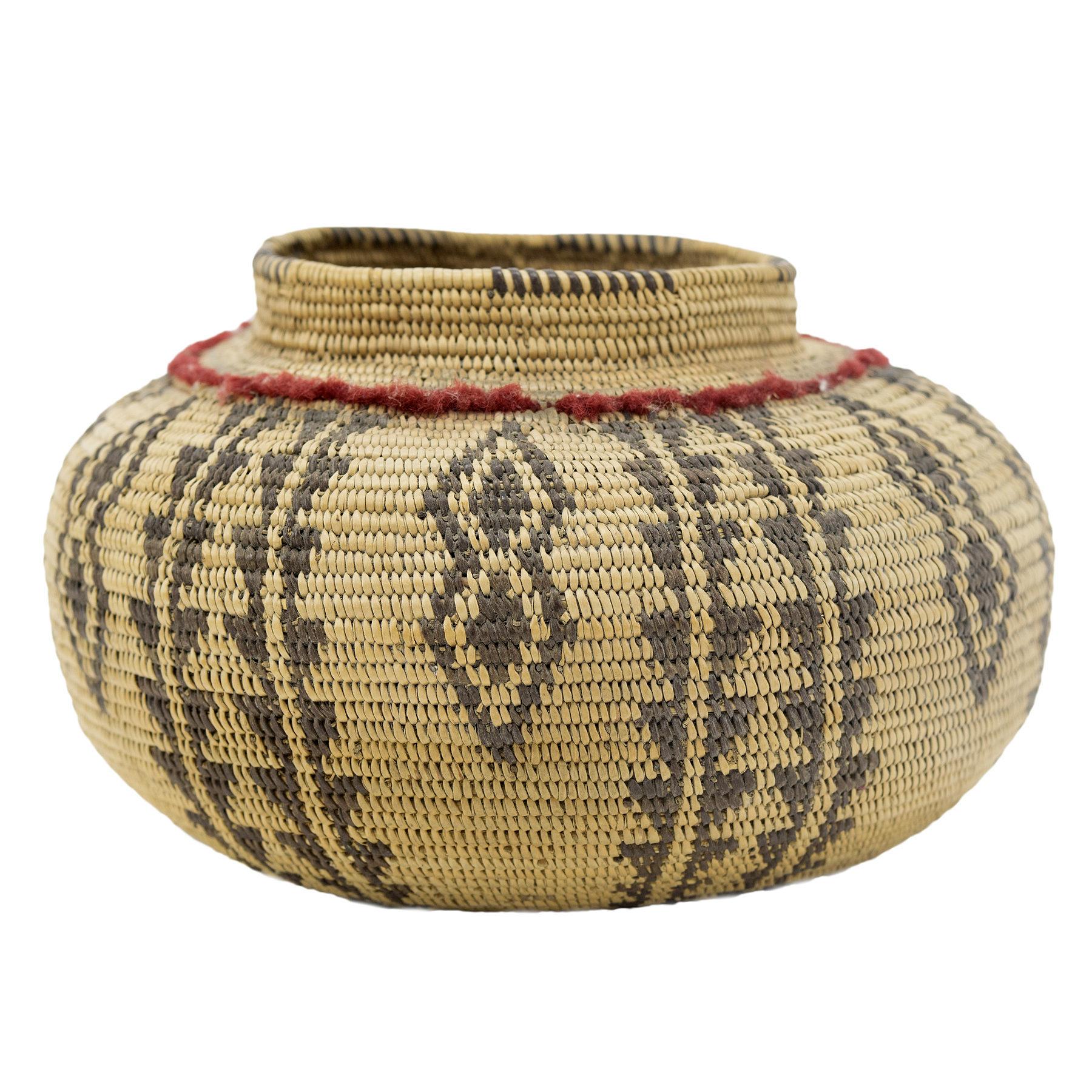 Highly decorated and finely woven shouldered basket with red wool decoration on shoulder

Period: Last quarter 20th century

Origin: Panamint

Size: 6