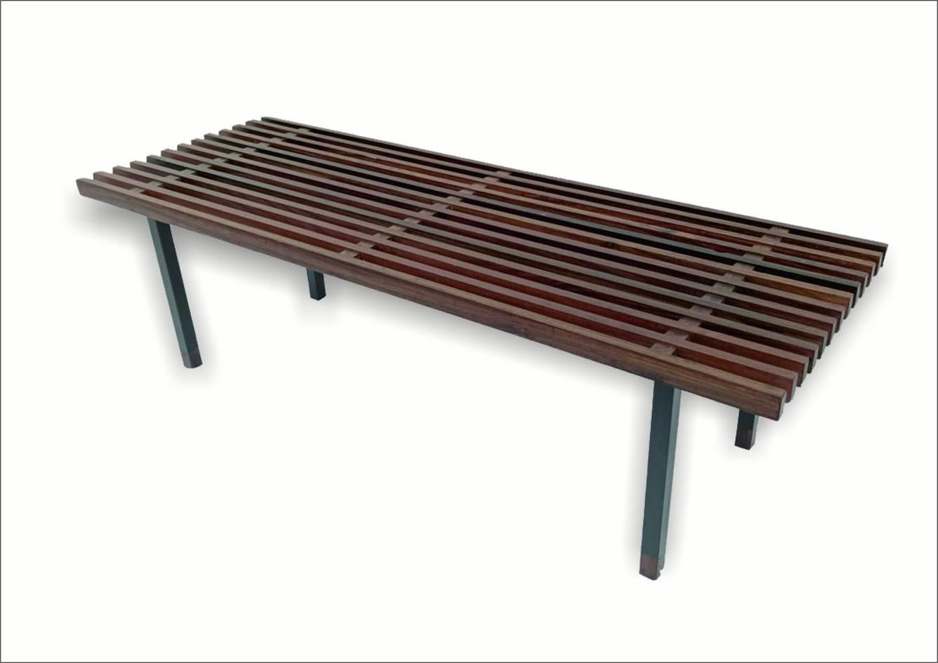 Rosewood and metal bench, Made in Italy, 1970s. 
Rosewood bench with tubular metal legs. The end of the leg is finished with rosewood. The product is in excellent condition. It has been restored while maintaining the patina of time. 
The price of