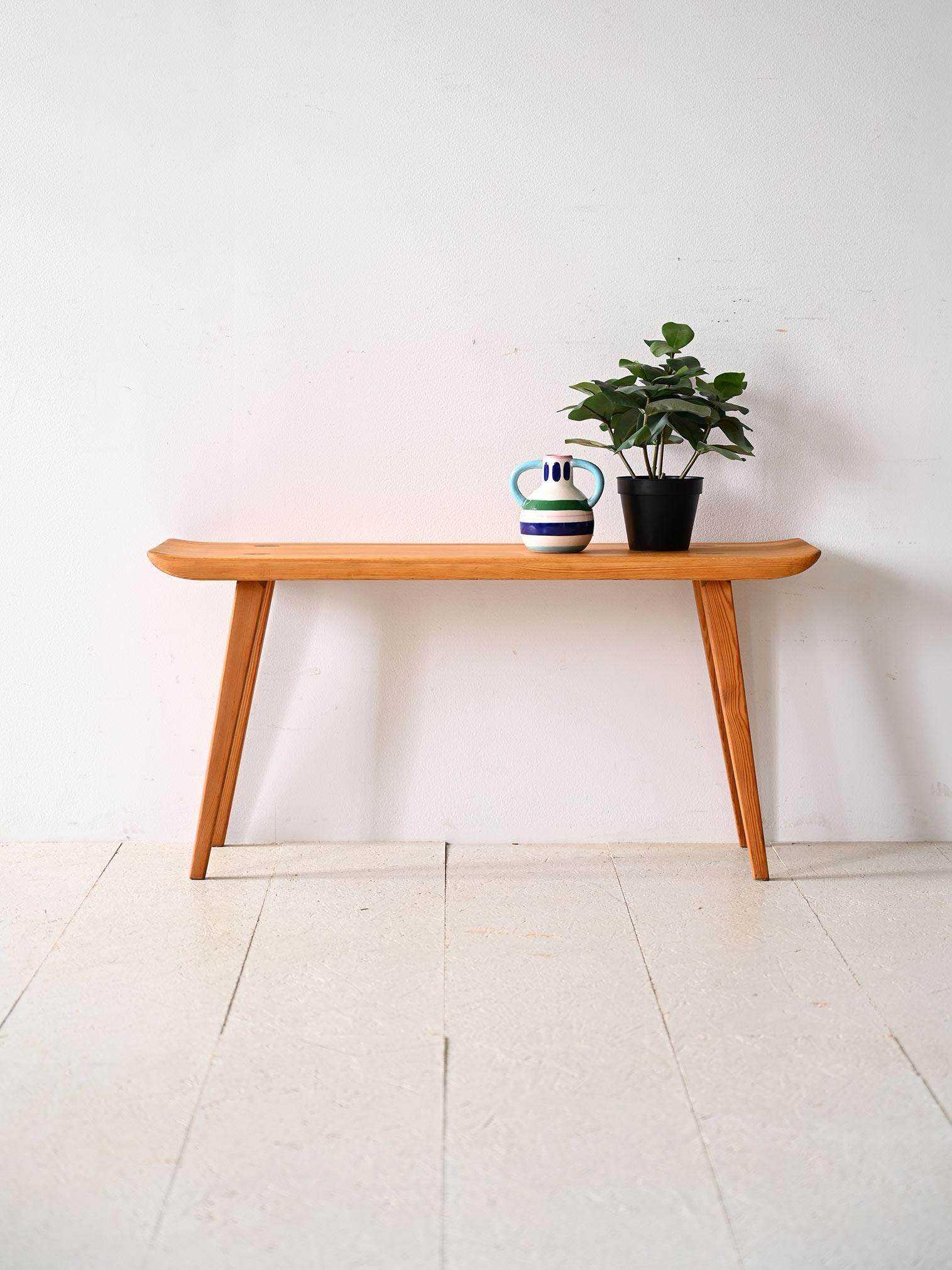 Swedish vintage wooden bench by Carl Malmsten for Svensk Fur.

This furniture model traces the modern rustic style typical of Scandinavian homes in the 1960s. 
Made of pine wood, thanks to its sober lines and refined details, it can be used not only