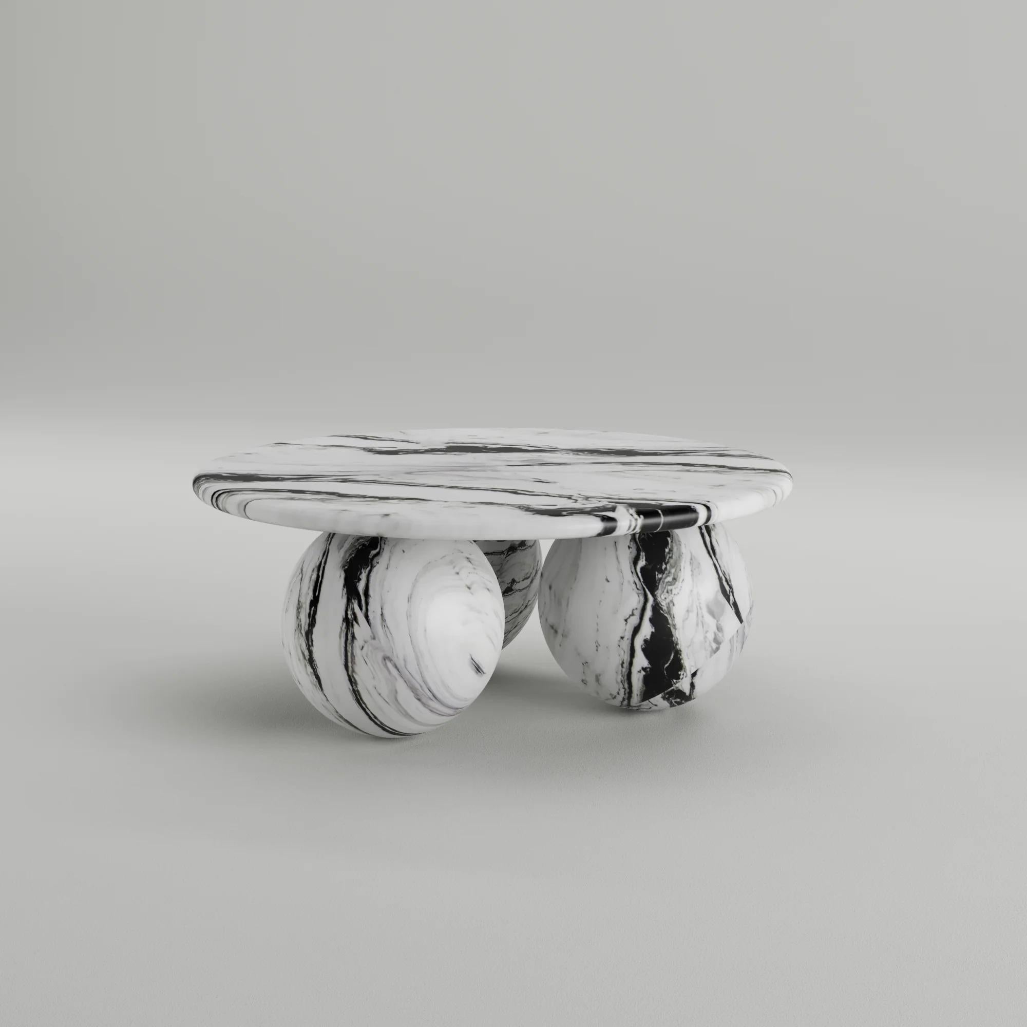 The Globe Coffee Table is a modern design masterpiece that epitomizes contemporary refinement. Crafted from high-quality Panda marble, this table features a sleek geometric design supported by three sculptural spheres at its base. Its sheer