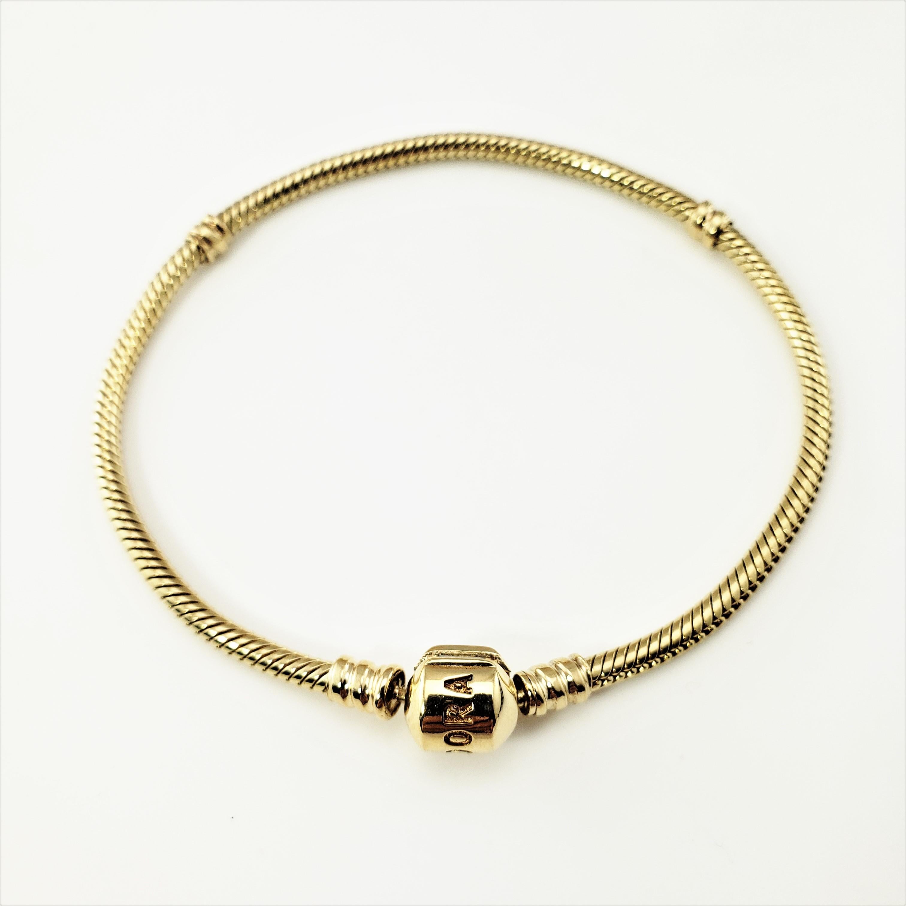 Pandora 14 Karat Yellow Gold Bracelet-

This classic charm bracelet by Pandora has a barrel clasp and is the perfect way to showcase your Pandora charm collection!

Size:  7.5 inches 

Width:  3 mm

Weight:  11.6 dwt. /  18.1 gr.

Hallmark:  PANDORA
