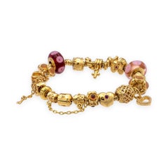 Pandora Armband aus massivem 14-karätigem Gelbgold mit 19 Charmen, 7,25"