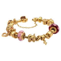 Pandora Armband aus massivem 14-karätigem Gelbgold mit 19 Charmen, 7,25"