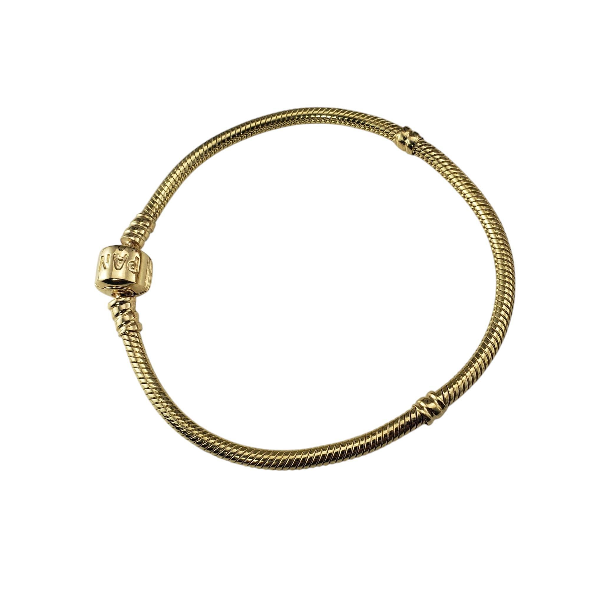Pandora 14K Yellow Gold Snake Chain Charm Bracelet-

This sleek 14K yellow gold snake chain Pandora bracelet offers a smooth, flexible fit while providing an elegant foundation for your favorite charms. Whether worn alone for a minimalist look or