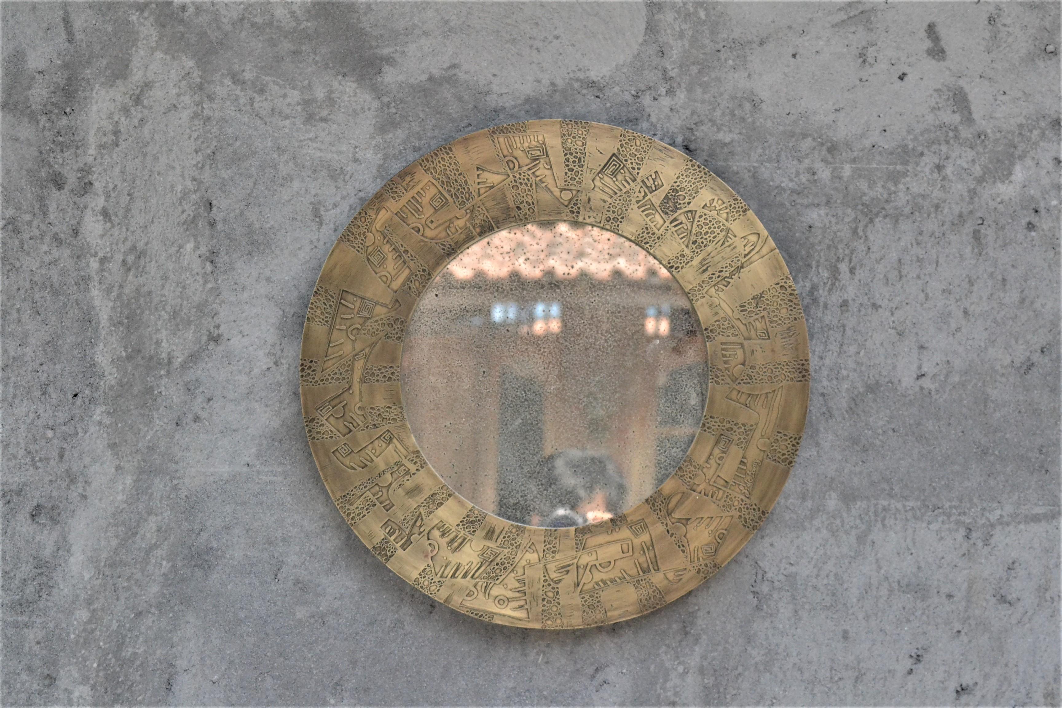Unique small round 50cm diameter wall mirror by Studio Belgali, handmade acid etched brass with hand drawn pattern combined with antique mirror. 

Stunning piece of art. Custom made is possible.