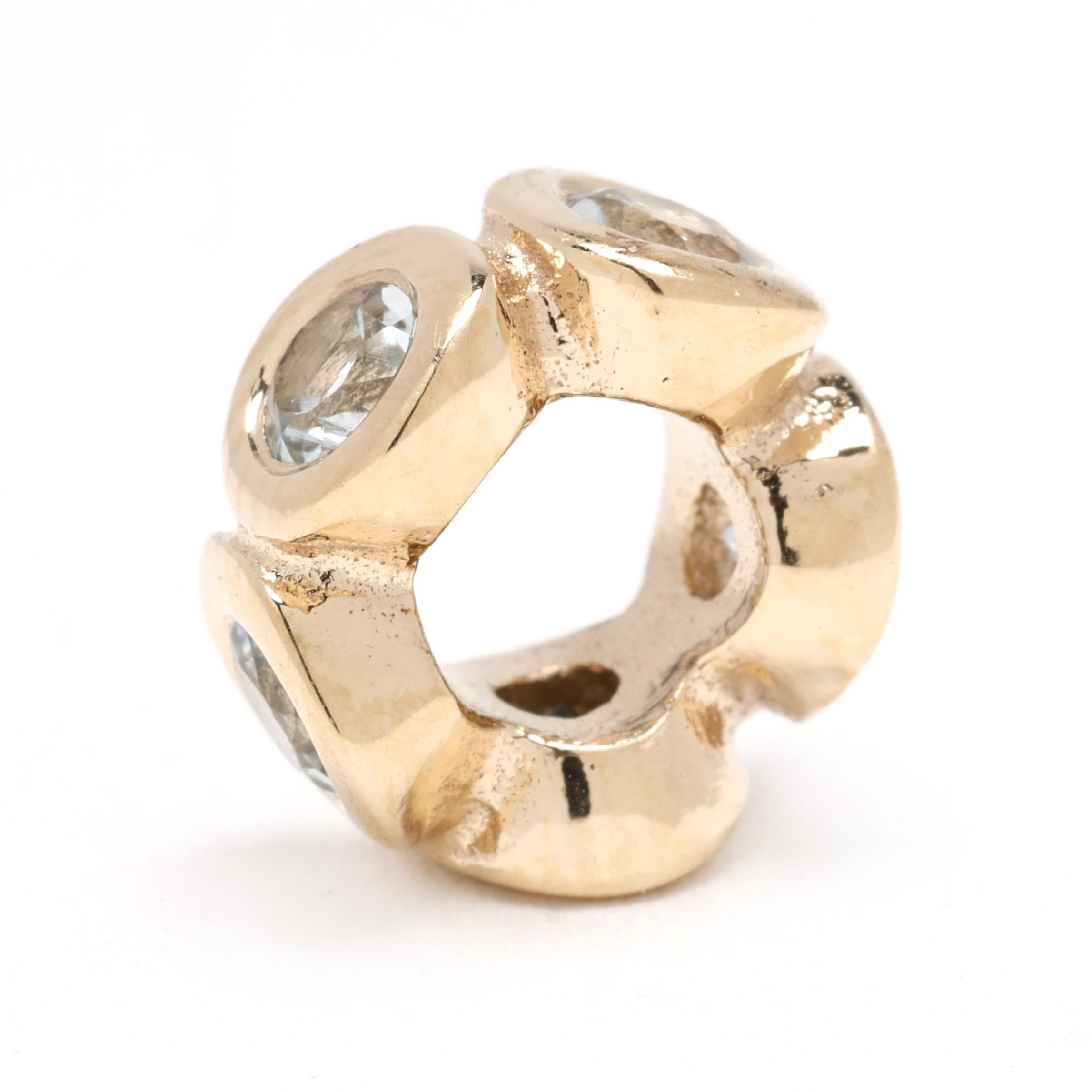 Enhance your PANDORA bracelet with the Aquamarine Lights Spacer Charm, crafted in radiant 14k yellow gold. Featuring soft aquamarine hues, this charm adds a touch of understated elegance and sparkle to your jewelry collection. Perfect for layering