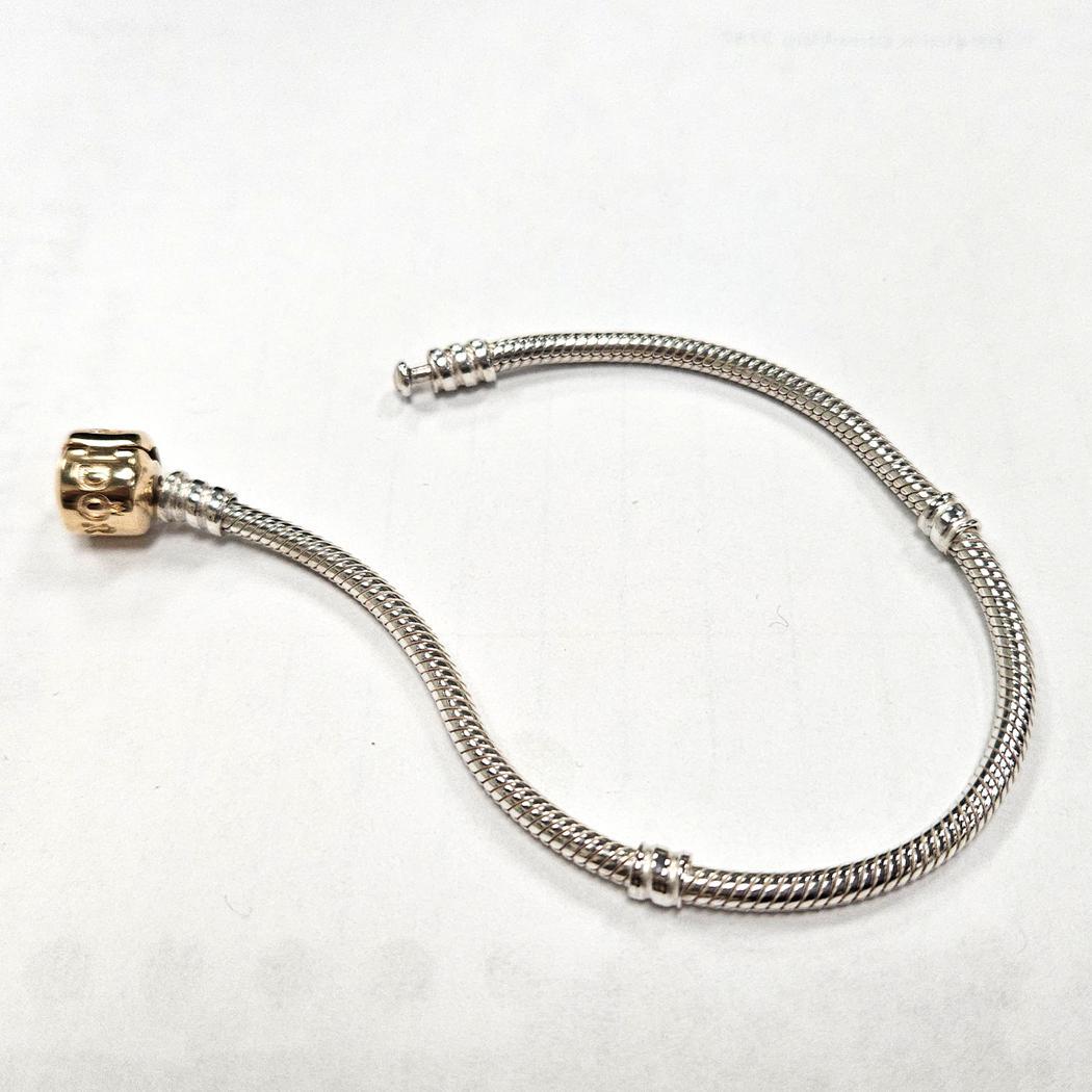 Donna Bracciale Pandora in argento e 14Kt misura 7 in vendita