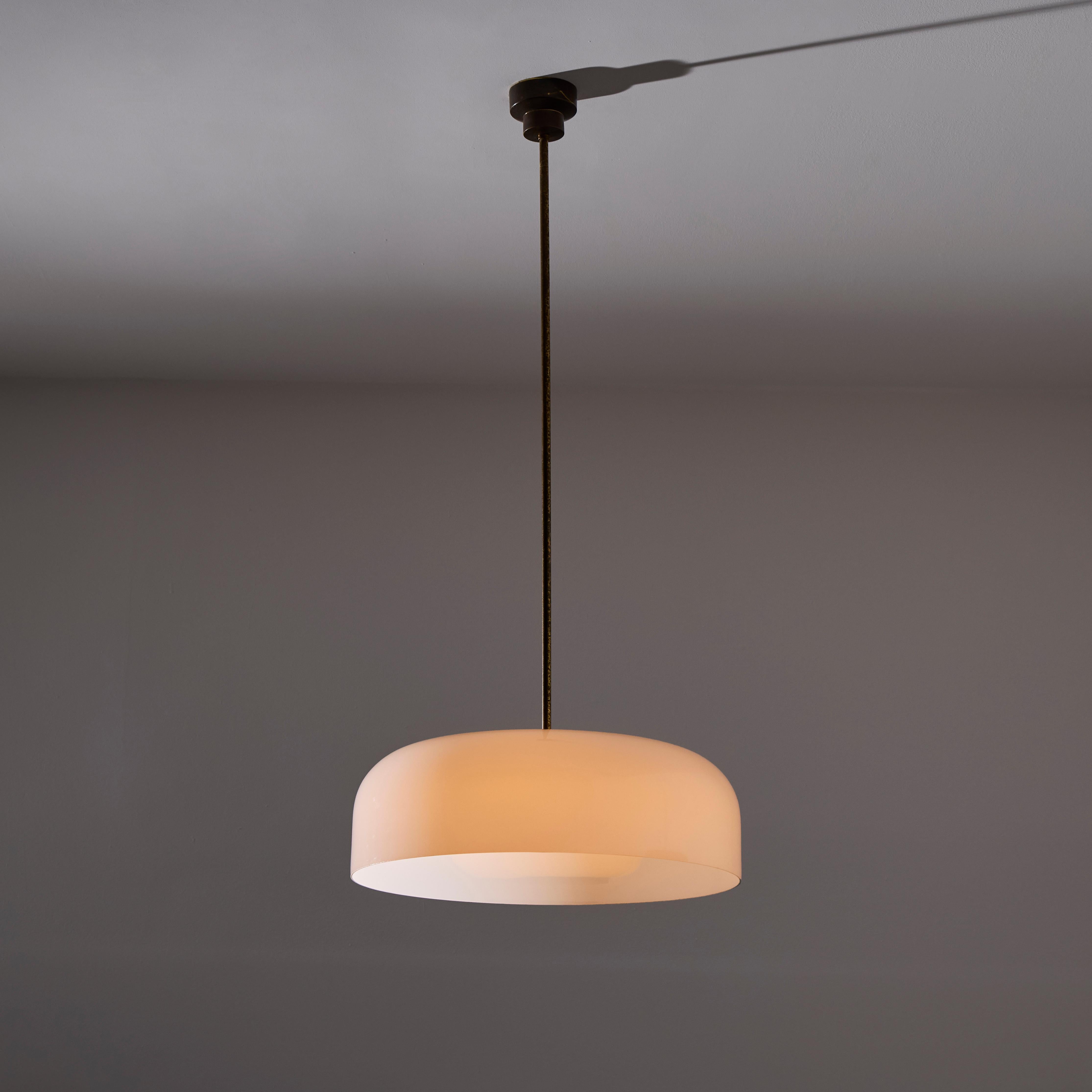 'Pandora' Ceiling Light by Sergio Mazza for Artemide (IT, c. 1960s)

Subtle and interesting design featuring a bottom center black cap and an open faced socket housing at the top. The entire diffusion being the opine white glass. The bottom section