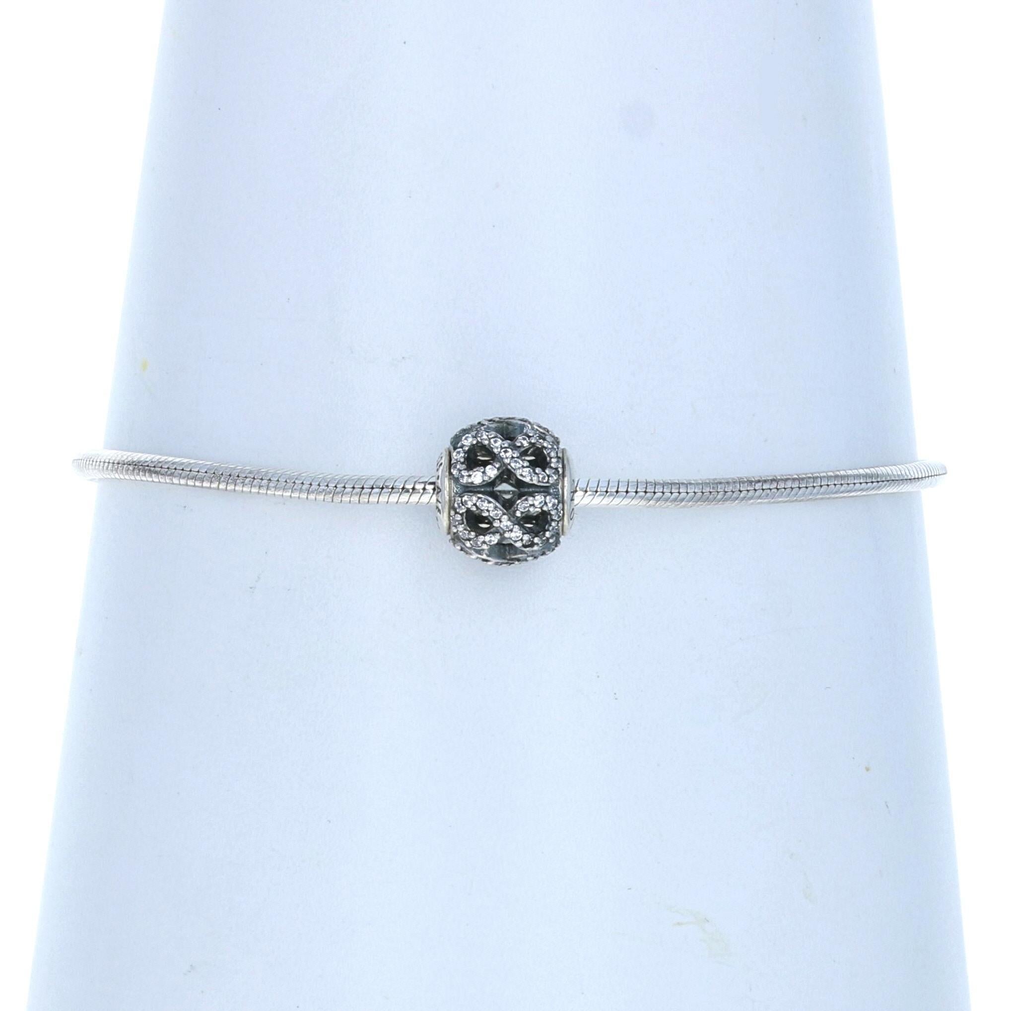 This beautiful set would make a perfect addition to your collection! We recently bought out a jewelry store that was an authorized Pandora dealer, and this piece is guaranteed NEW and 100% authentic. The sterling silver piece is  part of the Essence