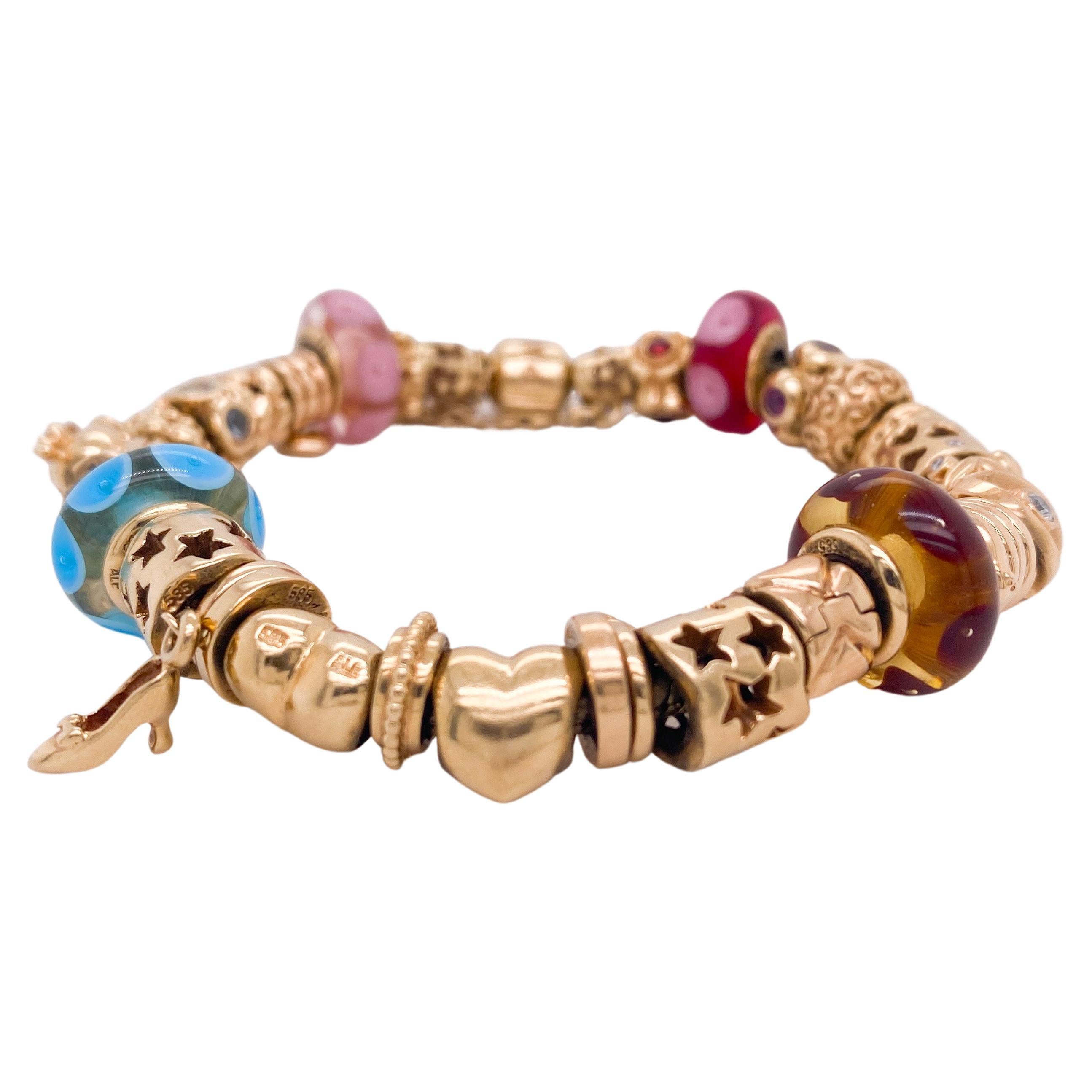 This original Pandora bracelet is solid 14 karat yellow gold and has the most interesting and unique designs that they make. There are 33 slide charms that have different textures and designs and every time you look at it you see a different