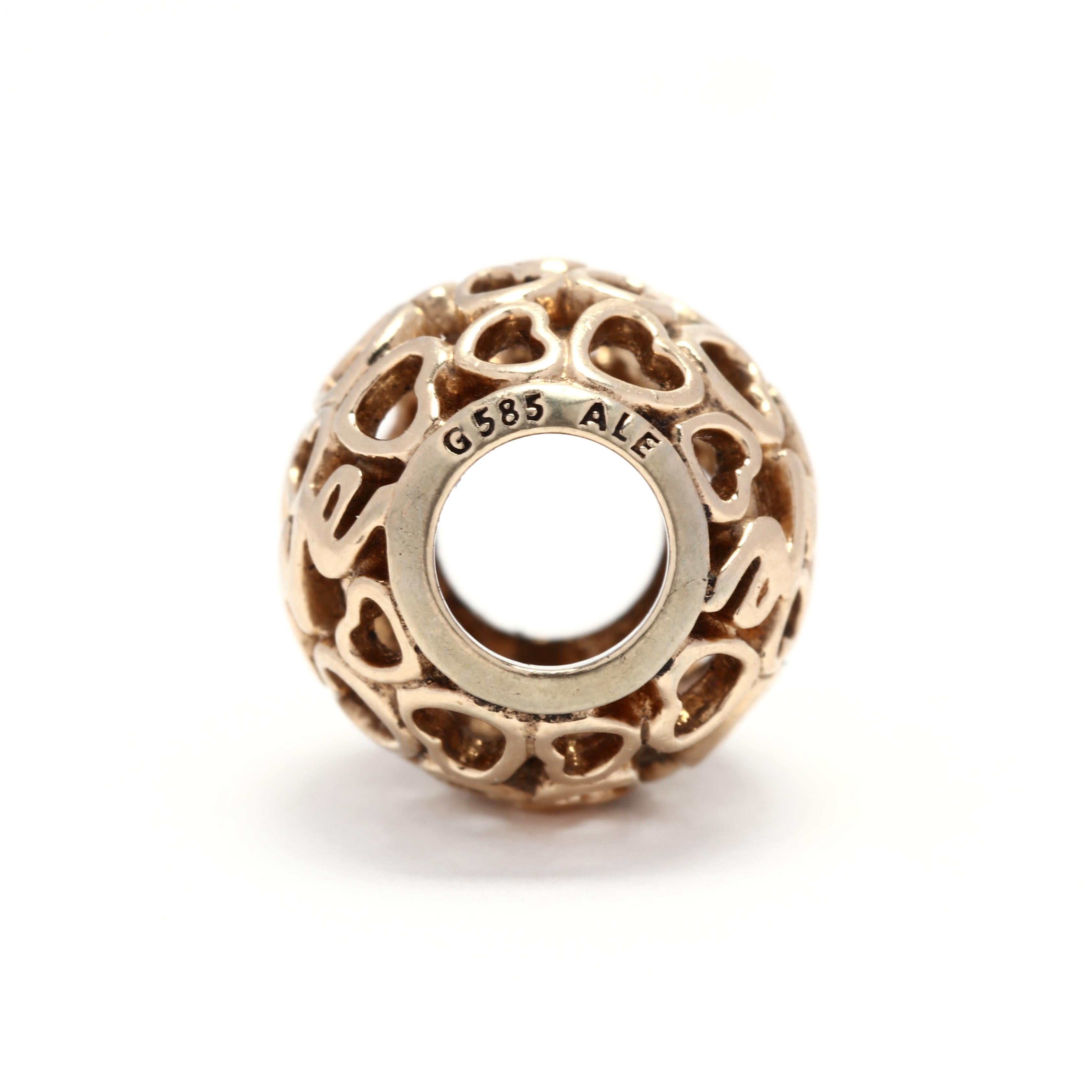 A Pandora 14 karat yellow gold open heart round bead. This bead features various sized open heart motifs and LOVE in a round bead.



Length: 3/8 in.



Weight: 1.4 dwts.