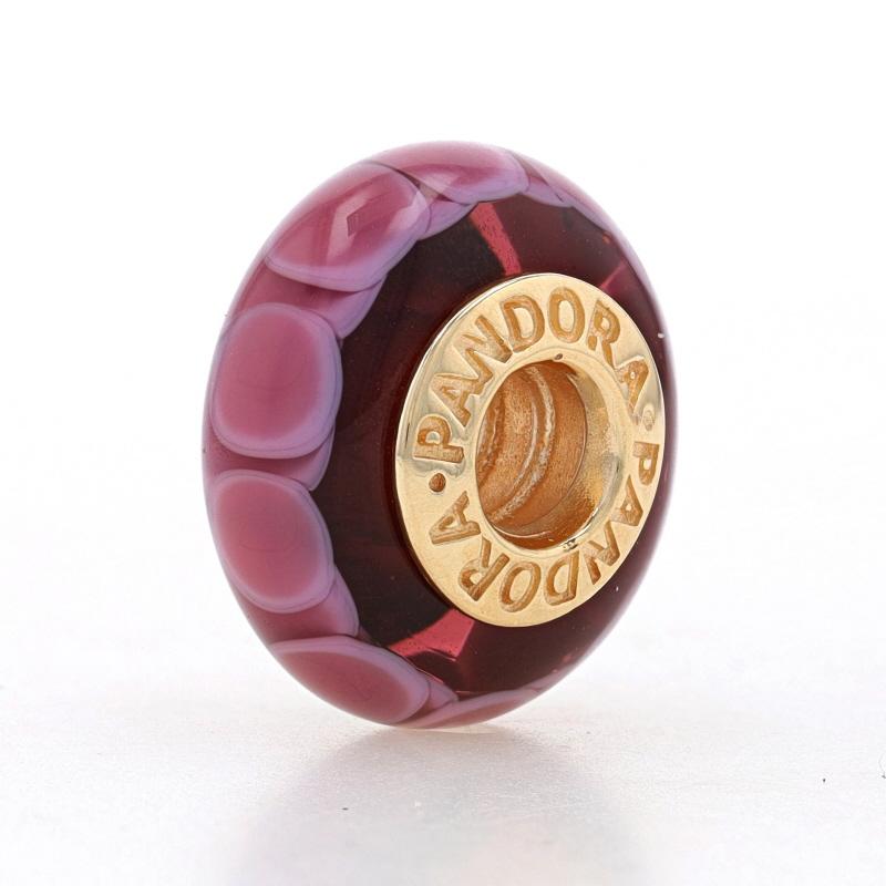 Brand: Pandora
Style Number: 750505
Title: Purple Lotus

Metal Content: 14k Yellow Gold

Material Information
Murano Glass
Color: Purple

Style: Charm

Measurements
Tall: 19/32